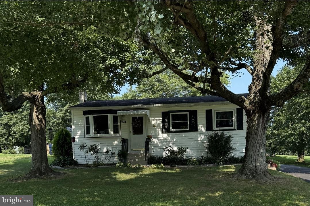 Delightful and deceptively spacious expanded ranch in Warwick Township! This beautifully maintained country home, located in the highly sought-after Owen J. Roberts School District, is staged to impress and available for quick settlement. Thoughtfully expanded with a family room and enclosed sunroom, it offers generous living space featuring hardwood floors, an inviting eat-in kitchen, and carpeting in the sunroom. From the welcoming front porch and bay windows, enjoy peaceful views of the surrounding countryside, and peak a boo views of the golf course. Multiple ceiling fans help keep the home comfortable year-round. Additional features include a detached 2-car garage with an entry door and the option to add a garage door, a full open basement with Bilco door access, and nearly one acre of level ground with low taxes. A new well pump was installed in 2025, and the home is equipped with a water treatment system, and a generator hookup with separate electric panel. New driveway in 2025, two large decks, and raised flower bed. Experience one-floor living at its finest in desirable Chester County!
*Home has an operable cess pool, price was reduced in consideration of a new septic system, which will need installed at some point. Home is being sold AS-IS*