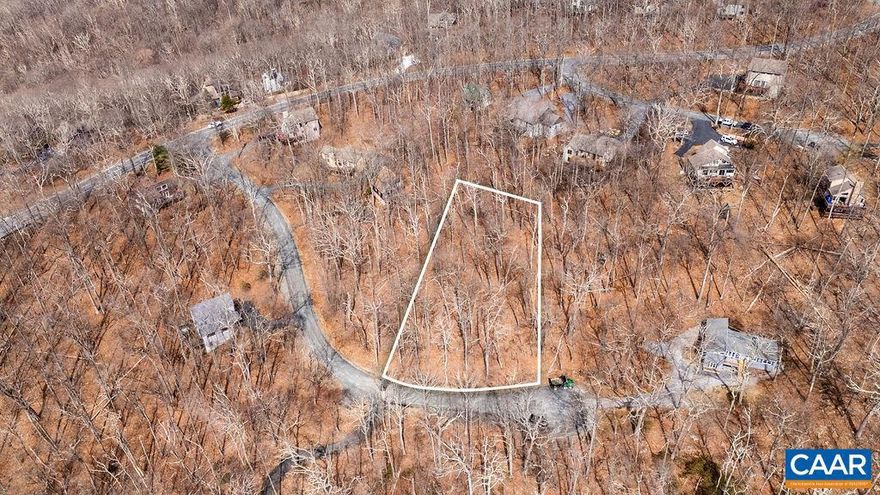 What a wonderful setting for your dream mountain home! This vacant lot is situated at the end of a quiet cul-de-sac, offering privacy and a generous street frontage. The expansive frontage allows for a beautifully curved driveway with convenient parking in front of your future home. Featuring a natural slope, this lot is ideally suited for a two-story design, maximizing both space and scenic views. Its sought-after southern orientation ensures abundant natural light throughout the day, creating a warm and inviting atmosphere year-round. Enjoy seasonal mountain views that enhance the charm of this picturesque location. Outdoor enthusiasts will appreciate the close proximity to several hiking trails, providing easy access to Wintergreen?s stunning natural beauty. As this homesite is located within a couple of miles from the Wintergreen Resort entry, you would also have a shorter trip to all the fun recreational venues located in Nellysofrd and the surrounding area. From here you are also at a quick drive to the ski slopes. A trully great location for anyone who wants to take advantage of both the mountain and valley lifestyle.