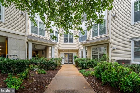 Photo of 3851 Aristotle Court #1-404, FAIRFAX, VA 22030 (MLS # VAFX2289446)