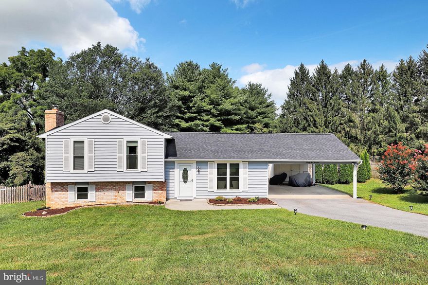 Here’s your chance to own this Impressive Single Family Home with a PRIME LOCATION within the Carroll County School District! That’s right, this Reisterstown, MD home has Carroll County Schools. The home’s other notable features include an open layout, vaulted ceilings, gleaming floors, bright & sunny kitchen with quartz  countertops, stainless steel appliances, beautiful tile backsplash and a separate island. All bedrooms are spacious including the Primary suite with a newly organized extra large walk -in closet! The finished lower level offers even more living space with its large family room, wood stove and half bath. Other significant upgrades include the new triple pane composite windows (2023) and New Roof (2022). The expansive backyard oasis is fenced-in and includes a stone patio with trellis, a great place to relax after a long day or entertain. This is the perfect yard for summertime fun! The new shed is an added bonus as well. This home is a commuter’s dream since it’s convenient to Interstate 795 and Route 32. Parking is a breeze with the covered car port and extra long private driveway. This amazing home sits on just over a half acre and exudes serenity. Nothing to do here but move-in and enjoy. Welcome Home!