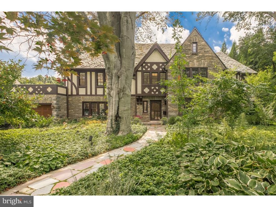 Extraordinary renovation...sprawling Tudor on nearly half-acre lot with mature landscape on one of Merion's premier streets. Original details sensitively preserved, but floor plan significantly altered by current owners for modern living.  Exceptional features/finishes throughout.  Formal entry with original black/white marble flooring, new 1/2 bath and architecturally important stair. Beautifully-proportioned living room with beamed ceiling and wood-burning fireplace. Opposite living room is custom kitchen with classic white lacquer and walnut cabinetry, open shelving, quartz counters, oversized island, Wolf cook-top with downdraft, double ovens and separate pantry.  Kitchen opens to dining room and family room with extensive built-ins, beamed ceiling and wood-burning fireplace w/stone surround.  Dramatic screened porch accessible from family room and kitchen overlooks tiered, flagstone patios with stone retaining walls and flat yard ideal for outdoor entertaining.  Mud room exits to attached, 2-car garage.  2nd floor: luxe master suite with private deck, stylish built-ins/storage, and lavish en-suite bath with Ann Sacks Tile, water closet, custom vanity, stone counters, free-standing soaking tub and separate, over-sized shower with frameless glass enclosure.  Guest bedroom with new hall bath, hallway laundry area, and two additional bedrooms with new, shared hall bath.  Back stairs to kitchen, and additional 3rd floor/finished attic space.  Finished lower level spans entire footprint of home with separate family, gym, second laundry, and studio spaces.  Walk-able location minutes to Center City, and short drive to train stations/public transit. Note: Seller has approved plans for 16 x 40 foot pool. Inquire for details!