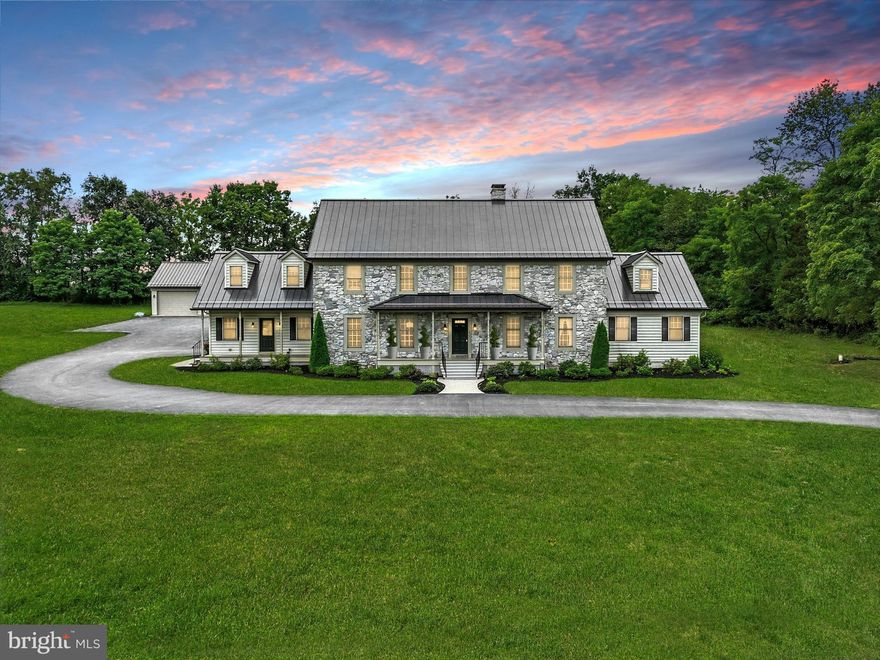 This exquisite colonial residence offers an unparalleled blend of luxury and comfort across 5,318 square feet. Set on a sprawling 3.32-acre lot, the property is enveloped by lush trees and woods, providing a tranquil retreat from the hustle and bustle of everyday life. Step inside to discover a meticulously designed interior that boasts six spacious bedrooms, the primary bedroom conveniently located on the main level. The heart of the home features an open floor plan that seamlessly connects the gourmet kitchen and family room, perfect for entertaining. The kitchen is a chef's dream, equipped with high-end stainless-steel appliances, including a six-burner stove, and an expansive island that invites culinary creativity. Rich hardwood and tile flooring flow throughout, complemented by exposed beams that add a touch of rustic charm. The double-sided stone fireplace, with glass doors, serves as a stunning focal point, creating a warm ambiance in both the family room and dining area. A formal dining room offers an elegant space for gatherings, while the breakfast area provides a cozy nook for casual meals. Additional highlights include a central vacuum system for effortless cleaning and a main-floor laundry for convenience. The partially finished basement offers endless possibilities for customization, whether as a recreation room or additional living space. With a four-car attached garage and a long driveway, parking is abundant. The detached garage is built primarily for larger vehicles which would be perfect for someone looking to run their business with the convenience of being at your own home. That includes an office that has its own separate keyed entrance. This property is not just a home; it's a lifestyle, offering the perfect blend of luxury, space, and natural beauty. Experience the tranquility and elegance that this exceptional residence has to offer.