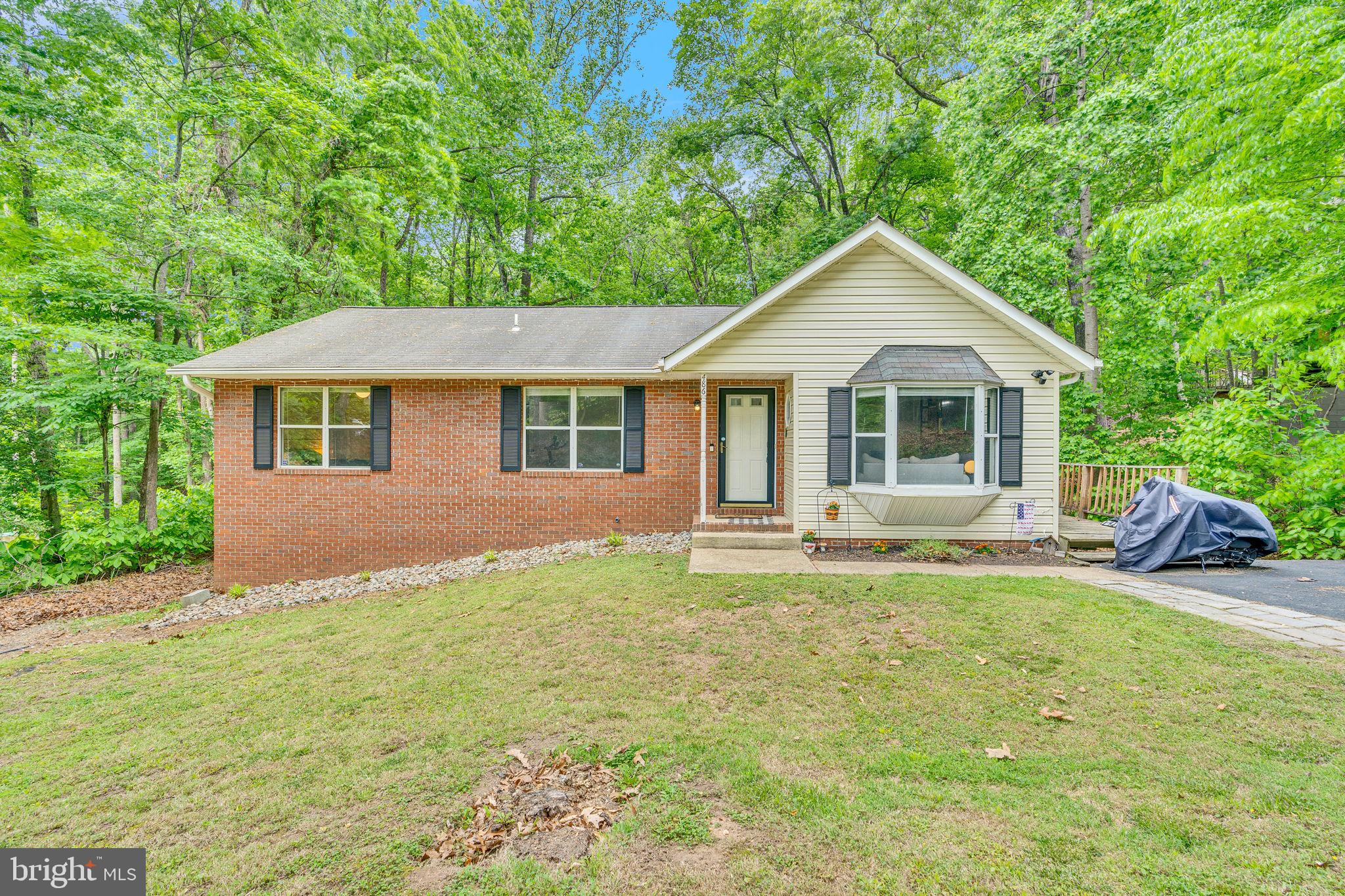 Offers deadline 5pm Friday 5/30 So much to offer here with this two level rambler. Main level features family room with cathedral ceilings open to dining room and kitchen with new counter tops, ceramic backsplash and stainless appliances. Head through the kitchen to enjoy the spacious screened back porch overlooking back yard with brand new privacy fence. Generously sized bedrooms on this level including a primary bedroom with walk in closet, second closed and private bath plus two additional bedrooms and hall bath all on this level. Lower level doubles your space and awaits your finishing touches to the recreation room open to area with counter top space, fourth bedroom, half bath and storage and laundry room. Two separate parking areas gives room for a crowd to park. Located in a Chesapeake Bay beach front community with two bay front beaches, lake front beach, gardens, play areas, and more. Close to shopping, restaurants, parks and historic Solomons Island.