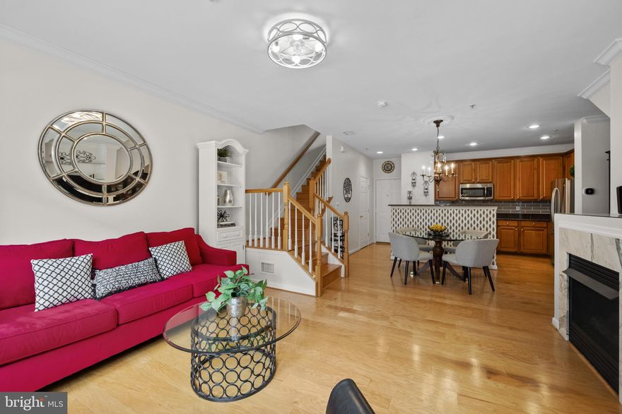 Experience the best of Lakelands living in this beautifully maintained home, just steps from Kentlands’ vibrant shops, restaurants, and trails.  Step inside to an inviting main level featuring a spacious open floor plan, hardwood floors, and a cozy gas fireplace—perfect for relaxing or entertaining. The kitchen is a chef’s delight, equipped with stainless steel appliances and ample cabinetry. The garage offers built-in shelving for extra storage, while the half bath adds convenience for guests.  Upstairs, the primary bedroom provides a generously sized retreat complete with a private full bathroom. A second bedroom and an additional full bathroom offer flexibility for guests, a home office, or hobbies. The loft area opens to a large, private balcony—ideal for morning coffee or evening gatherings.  Enjoy peace of mind with recent updates, including a newer HVAC system, hot water heater, windows, and a washer/dryer combo for added convenience.  Live the walkable lifestyle Lakelands is known for—just steps from scenic trails, lakes, and everything Kentlands has to offer!