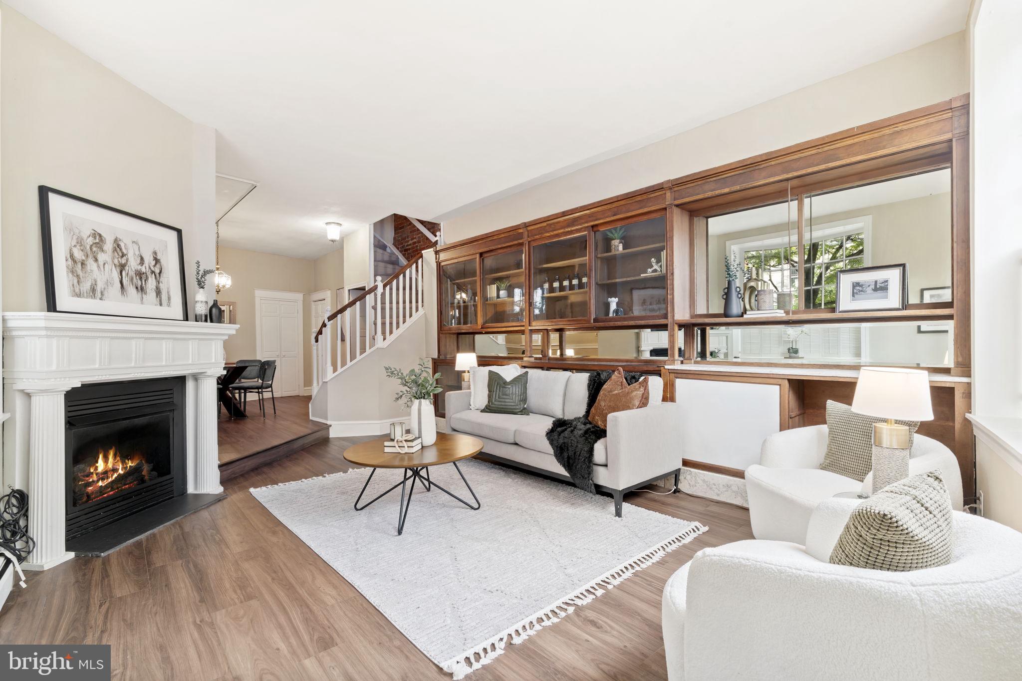 Historical Charm Meets Modern Comfort in the Heart of Queen Village
Welcome to 858 S Front Street, a distinctive corner property steeped in history and style—formerly a neighborhood apothecary and now a thoughtfully updated residence in the coveted Meredith School Catchment. This historic home is a one-of-a-kind property that blends original character with practical upgrades for today’s lifestyle.
Hardwood floors and exposed brick flow throughout the home, complemented by an abundance of natural light in every season. The living area features apothecary shelving—an elegant nod to the home’s heritage—along with a cozy gas fireplace. Just beyond, a dedicated dining area opens to a fully equipped kitchen with generous cabinet storage, built-in cabinet lighting, and stylish pendant lights. The first-floor powder room adds to the home’s functionality.
Upstairs, the second level hosts a spacious primary bedroom and a beautifully appointed full bath with a soaking tub and separate shower. A second large bedroom with a laundry closet completes this floor. On the third level, you'll find an additional large bedroom and a versatile bonus room—ideal as an office, den, or fourth bedroom—with access to a fabulous deck, perfect for entertaining or enjoying your morning coffee in the sun.
The finished basement adds flexible living space along with a second half bath—perfect for a media room, gym, or guest space. Enjoy the benefits of a corner property with multiple access points that make city living more convenient.
Located directly across the street from the popular For Pete’s Sake Pub and just moments from Shot Tower Recreation Center, Mario Lanza Park, Headhouse Square, Capri, Cosa Nostra, Philadelphia Java Company and a wide array of Queen Village’s best cafes and shops. Center City is easily within reach. Sellers will pay for one year of parking at the Queen Village lot across the street from the listing.
Don’t miss your chance to own a rare piece of Philadelphia history, reimagined for modern living.