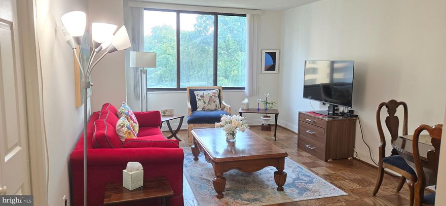 Welcome to 703n …..a furnished, modern, charming, spacious apartment in the prestigious Promenade Towers. There are wood floors throughout and oversized windows with terrific views.  The large kitchen has handsome stone counters, a gas stove, microwave, and stainless dishwasher and refrigerator.   The kitchen opens to the living room.  There is plenty of closet/storage space.   The bedroom has mirrored doors on the walk-in closet which is large and has built-ins.  The bathroom can be accessed from both the living room and the bedroom.  It has a large sink cabinet with stone counter, glass shelves and a barn door.   Rent includes a garage parking space.  The building has so many amenities, it lives like a resort. The lobby is in the process of a complete renovation.   The recently redecorated Arcade level has the state of the art fitness center with indoor pool and hot tub: locker rooms with showers and sauna.  Also in the Arcade is Chef Tony’s restaurant (a well known seafood/Italian eatery), a grocery store/deli, dry cleaners, travel agent, beauty salon, resident lounge, party and conference rooms.  There is a large outdoor pool with adjacent grills.  Tennis (lighted courts) and pickelball have their own building as you drive onto the property.  Ping pong is played regularly, as are social activities such as “Breakfast at Wimbleton”.  There are too many activities to mention them all.  A few are …trivia night, open mike night, monthly first fun movies, lectures, vaccinations, vote in all elections in the party room (including Presidential).  There is meditation, exercise class, book club, canasta, bridge, and mahjong.  We have wine and cheese get togethers in the lobby, a rocking New Year’s Eve party and various other celebrations.  We have car charging stations, and a car washing area with a dynamite vacuum.  Garage parking comes with the unit.  It is easy to get to the Red Line Medical Center metro stop at NIH/Walter Reed.  The bus comes to the door of the Promenade.  Close to 495 and 270.  Nearby Wildwood Shopping Center has Balduccis, CVS, Bethesda Bagels, Starbucks, a number of places to eat and several cute boutiques.  Giant food is just across the street.