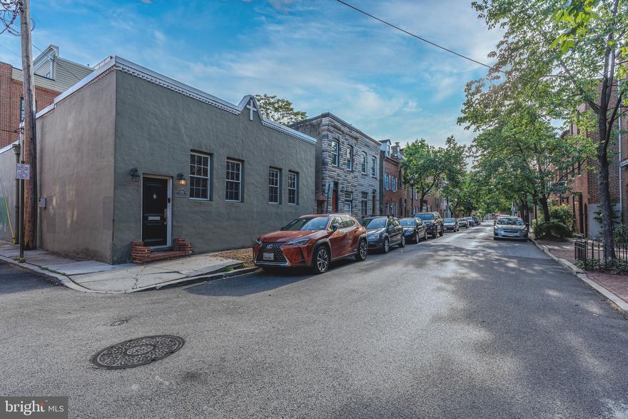 **Fells Point Unicorn** Rare opportunity to own a detached, single-level property with garage parking in the heart of Fells Point District. Currently being used as an office, previously used as a photography studio. Multiple uses in this zoning. Be steps from all the action and amenities. Hardwood floors throughout. Central AC installed. Multiple configurations are easily possible. Full bath and kitchenette with luxury finishes.