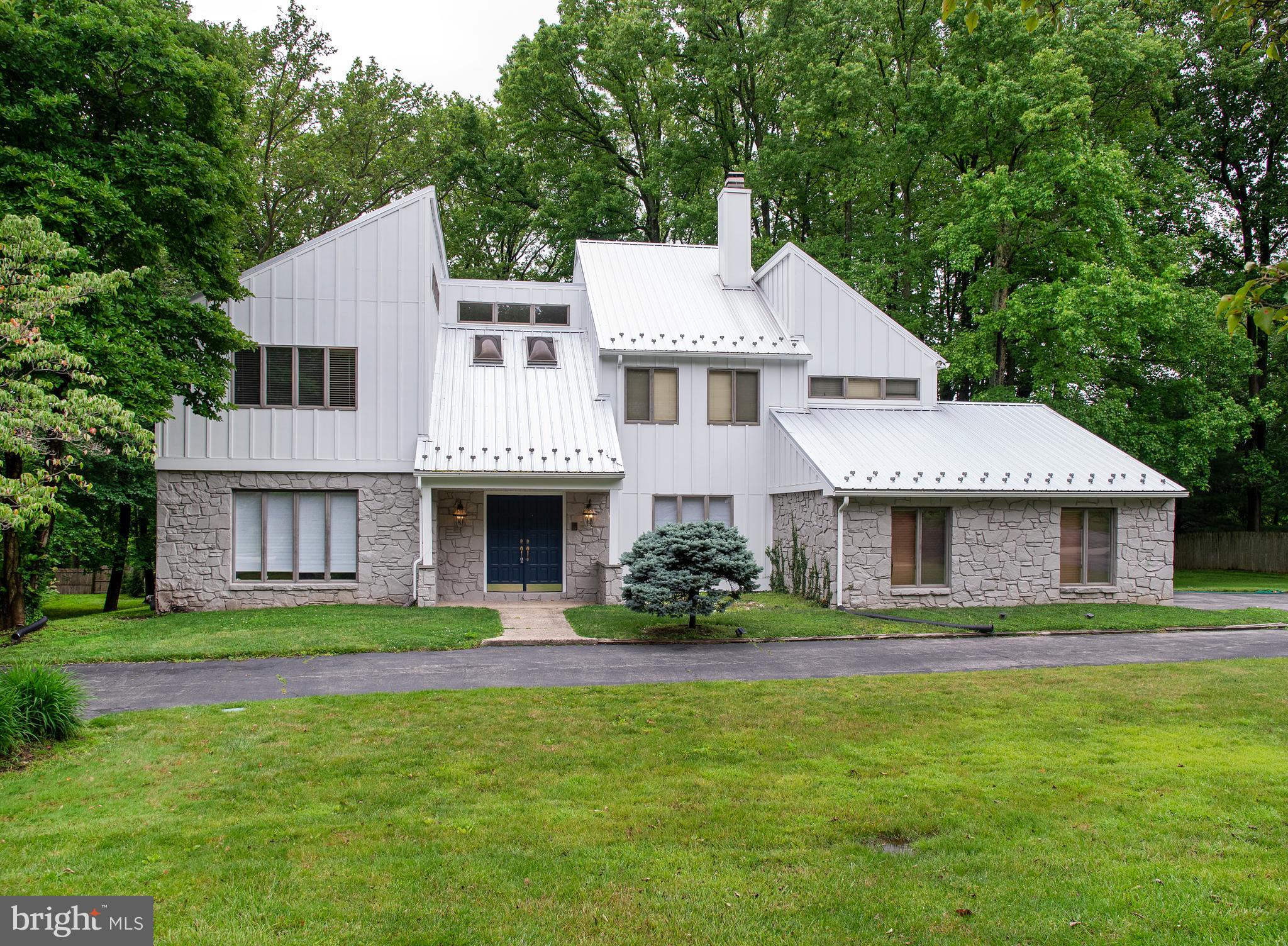 This magnificent home offers a contemporary facade, traditional floor plan, and is located in one of the most desirable family friendly neighborhoods of Bryn Mawr. It is in pristine "move-in" condition. Exquisitely appointed throughout, the first floor includes a 2-story Reception Hall, Living & Dining Rooms with hardwood flooring & decorative moldings. Spanning the entire width of the home, the open floor plan includes a Kitchen with white cabinetry, a center island & black absolute granite; Breakfast Room & Family Room with greenhouse style windows & fireplace. The 2nd floor includes the expansive master Bedroom Suite has a vaulted ceiling, fireplace & private Bath, together with 3 additional spacious Bedrooms plus a Hall Bath. The Lower Level is beautifully finished with a Recreation Room, Bonus Room with closet adjacent to a Bathroom with tub/shower & Laundry Room. The level rear grounds are perfect for entertainment & recreation.