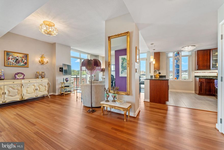 Stunning Potomac River Views | Redesigned 2-Bedroom + 2 Bath with large Dining and Living Room Areas.  Corner Unit with 180 degree views.  

Every so often, a truly exceptional home becomes available — one that flawlessly combines architectural sophistication, timeless design, and an unbeatable location. This is that rare opportunity.  Ask about the separate exceptional package deal for all the furniture.

Located on the 9th floor of a highly sought-after concrete and steel building, this expansive two-bedroom  with large Living room, Dining Room area, corner residence has been thoughtfully redesigned and enlarged. The result is a layout that far exceeds the original builder’s vision. With two exposures and floor-to-ceiling windows, the home is filled with natural light throughout the day. Thanks to its unique corner position with no immediate neighbors, the residence offers a remarkable level of privacy that’s rarely found in urban settings.

The home features spectacular, unobstructed views of the Potomac River, and includes two deeded garage parking spaces and a private storage unit. Three Juliette balconies provide charming outdoor touches and additional light and air flow.

Inside, soaring ceilings and Brazilian cherrywood floors create a sense of warmth and elegance in the living areas. The upgraded two-cycle HVAC system ensures personalized comfort throughout the home. The chef’s kitchen is a standout, featuring granite countertops, stainless steel appliances, a modern tile backsplash, under-cabinet lighting, and custom 42-inch cabinetry.

The spacious laundry room includes a full-size washer and dryer along with built-in shelving for added storage and organization. The primary  bedroom offers 2  huge walk-in closets, plus the foyer has a walk- in closet in addition to a foyer  coat closet, providing abundant space for wardrobe and storage needs.

The spa-like primary bathroom includes a luxurious soaking tub and a separate stand-alone shower. Both bathrooms have been upgraded with customized mirrors, adding a designer touch. Cellular blinds in the primary bedroom — and throughout the home — provide style and privacy. The entire home is in immaculate, move-in ready condition. Just bring your bags!

The community offers exceptional amenities, including a rooftop pool and observation deck with sweeping views of the Potomac River, the Washington Monument, MGM National Harbor, and Old Town Alexandria. Residents also enjoy a state-of-the-art fitness center and an elegant lounge that’s perfect for entertaining guests. Professional on-site management and concierge service provide added convenience and peace of mind.

This unbeatable location is just minutes from Washington, D.C. and Northern Virginia, offering effortless access to high-end retailers, renowned restaurants, and major transportation routes. The home is also convenient to National Airport, as well as Andrews and Bolling Air Force Bases.

Offering the perfect balance of luxury, privacy, and convenience, this residence represents city living at its absolute finest.