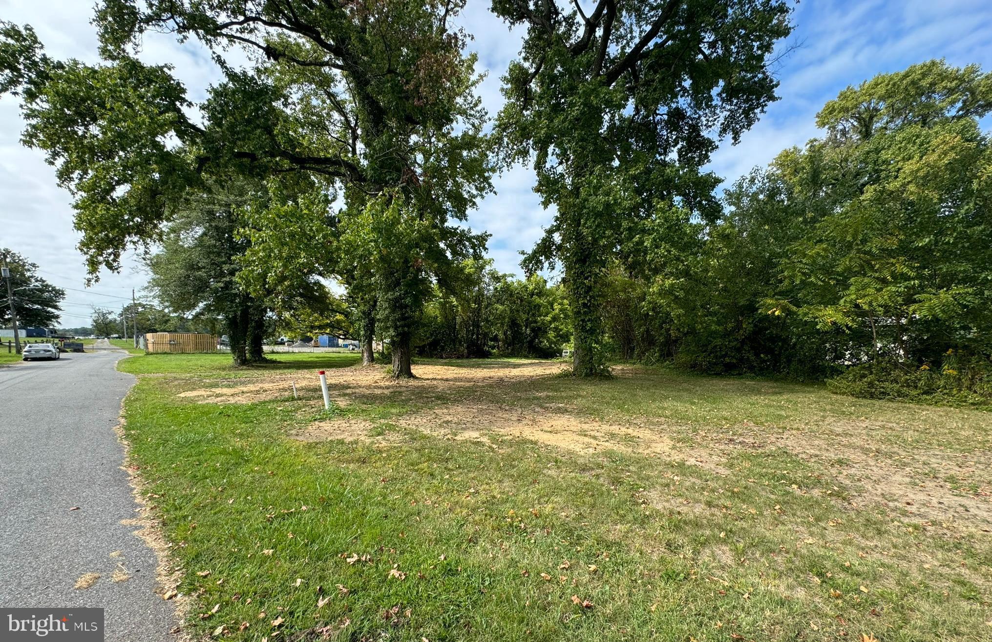 Here's your chance to build the home of your dreams on a wider lot with stunning water views and a serene wooded setting, all located on a quiet, non-thru street. The seller has a copy of the approved building plan and permit number, along with the physical permit, making this property nearly ready to break ground. With ample space and potential, you can work with any builders who are ready to provide competitive pricing for your new home. Whether you're planning a generational home or a personalized investment, this lot offers incredible opportunities in a great location just off the beltway. The tax record land square footage does not reflect the amount of land included in the sale. There is much more land square footage included in the sale. Please refer to the site plan in the view document section of the listing.