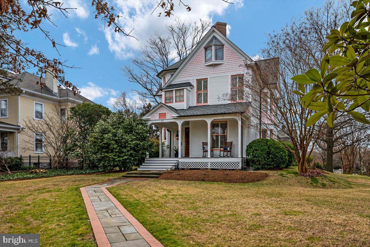 *Prime location in coveted Murray Hill* This beautiful historic home built by The Reverend Southgate in the late 1800s is loaded with charm and elegance that ensures comfortable living in the heart of Downtown Annapolis. Step up onto the oversized front porch of this thoughtfully crafted Victorian and become immersed in the Annapolis lifestyle. Once inside you are greeted by gleaming hardwood floors and an elegant curved staircase in the center hall. You will also find two large living areas and a formal dining room with a decorative fireplace and sliding wooden doors. Each room with soaring nine-foot ceilings. The kitchen has been tastefully updated with granite countertops, stainless steel appliances, and a newer backsplash. The cozy kitchen banquette is perfect for all meals and gatherings. The second level has three bedrooms, including the primary suite with a large, walk-in closet. Hardwood flooring and high ceilings are throughout. The third level of this spectacular home is the epitome of a bonus room. It has been recently renovated with new carpet, paint, and a bathroom with a luxurious clawfoot tub. You will also find a wet bar with storage and a refrigerator. This space is extremely versatile and can be used as an office, virtual learning center, or second primary suite. Don’t forget to take a step outside on the third floor deck with sweeping views of Murray Hill. If you peek through the windows at the front of the house you can see the steeples and spires of Historic Annapolis. There is a large, unfinished basement with ample storage space. You will fall in love with how the home stately sits upon a double lot surrounded by a newer stone retaining wall. The extensive landscaping and hardscaping add to the curb appeal. There is a porch on the rear of the home great for relaxing after a long day. The brick patio makes for a great space to entertain family and friends. The roof was recently replaced and exterior paint. Murray Hill is a coveted Downtown Annapolis neighborhood lined with sidewalks and accessible to a waterfront park, a perfect place to watch the sunset. Location is prime as you are within walking distance to fine dining, shopping, entertainment, and Main Street Annapolis. Commuting is a breeze as this home is close to multiple interstate routes, Washington DC, Baltimore, USNA, Ft. Meade, and BWI. Come see this one in person to learn about everything this amazing home has to offer!