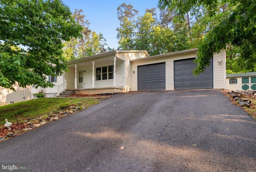 Welcome to this beautifully renovated 3-bedroom, 2-bath rancher with basement located in the highly sought-after gated community of Lake Holiday! Thoughtfully updated in 2022, this move-in ready home features new cabinetry, countertops, appliances, flooring, paint, and renovated bathrooms, blending modern style with everyday comfort. The bright and spacious living room offers abundant natural light and recessed lighting, creating a warm and inviting atmosphere. The updated kitchen showcases contemporary finishes and new appliances designed for both functionality and style. A full unfinished basement provides endless possibilities for expansion—perfect for creating additional living space, a recreation room, home gym, workshop, or storage area. With the potential to nearly double the home’s living space, the opportunities are endless.
Additional recent improvements include a newer roof (within the last 5 years) with gutter guards for added convenience and protection. Outside, a partially fenced yard offers a great space for pets, play, or outdoor entertaining. Enjoy all that Lake Holiday has to offer, including a private lake for boating, kayaking, paddle-boarding, fishing, and swimming. Community amenities include sandy beaches, picnic areas, playgrounds, tennis courts, volleyball and basketball courts, frisbee golf, fitness facilities, and a dog park. This exceptional property combines modern updates, flexible living space, and resort-style amenities in one incredible location. Schedule your private showing today!