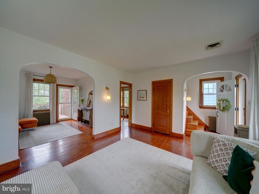 Bright and airy colonial with 3 bedroom, 1 full, 2 half baths, ready for it's next owner. This home has been meticulously maintained and includes a blend of recent updates and historic features to provide modern comforts while preserving it's original charm. The main level has an open flow between living room, dining room, breakfast room and kitchen plus a half bath located off the foyer. Hardwood floors throughout this level with matching wood baseboard trim, high ceilings and updated lighting fixtures with MCM design. Kitchen has been remodeled to include white cabinetry, quartz countertops, recessed lighting, pantry, Stainless Steel appliances with gas cooking, dishwasher, built-in microwave and a Samsung 4-door Smart Screen refrigerator with a flexible beverage/freezer section. Breakfast room located off kitchen includes coffee station/bar, storage closet and access to full basement. Separate dining room with access to rear is a flexible space that could have many uses - currently used as a family room. Trex deck with steps to yard located off of dining room via upgraded glass door with built-in blinds. Wood stairs off foyer lead to the upper level with 3 bedrooms and full bath; wood floors throughout all bedrooms and 2nd level hallway. The lower level, has been updated to include an oversized family room, separate laundry/mud room with full sized washer/dryer and access to rear yard plus half bath, large storage closet and a separate utility closet. Numerous windows in lower level with walk out to rear yard or side door entry off the right of the home. Rear yard is fully fenced with a level, grassy yard, concrete sidewalks plus a stone & concrete patio under the deck which is a great option as a storage space. A detached 1-car garage equipped with electricity is located in the rear of the yard, with an additional space for off-street 1 car parking. Smart thermostat. Vinyl windows. Water heater replaced in 2025. Located within walking distance to grocery store, shops and restaurants. Easy access to major routes including 695 / 95 / 295 plus the 195 Park & Ride for commuters travelling to Baltimore or Washington DC. Quick drive to the very popular Patapsco State Park, downtown Catonsville, Historic Ellicott City, UMBC and BWI airport. Great employment areas close by with NSA/Ft Meade, BWI business district and downtown Baltimore all within 15 minutes away. Call your agent today and set up a private tour.