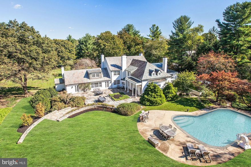 Incredible Gated Estate w/ 2.6+acres of lush landscaped privacy including Swimming Pool and Tennis Court!  Circular Driveway loops in front of the 8,900 SF home featuring 6 BR Suites, 7 Full + 2 Half Bathrooms, including a Main Level Master Suite w/ His & Her Baths and a Sauna. Fabulous floor plan perfect for entertaining with recent upgrades throughout. Bright open Kitchen, expansive patios, Wine Cellar, 6 Fireplaces (5 Indoor + 1 Outdoor), side-loading garage, too many details to list - Must See!