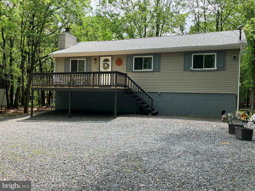 Inspections complete - buyer financing fell through. Great investment property in gated STR-friendly lake community. House is 3 bedrooms, 2 full baths, big game room, fireplace and front and rear decks. Includes all furniture, appliances, linens, kayaks, game equipment and kitchen items. Successful vacation rental - just move in and start making money.