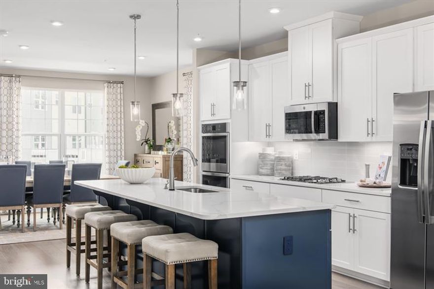 TO-BE-BUILT  SCHUBERT!
The Schubert, at the largest of the Composer II series homes, offers the space and customizing details of single-family living with the convenience of a townhome.  Enter on the lower level in the foyer or the 2-car front garage. A spacious finished rec room is located at the rear of the home with a walk out door that leads to the backyard.  On the main living level, you’re greeted by an enormous and airy kitchen with a huge island perfect for entertaining. The dining room provides space for a more formal meal while the great room is perfect for movie night evenings at home.  Up a flight of stairs designed to be elegant and functional, the upper level boasts three bedrooms, two baths, and a full sized 2nd floor laundry with extra shelf space and an optional laundry tub. No need to worry about storage space – generous closets abound in both bedrooms. The Owner’s Bedroom is a private retreat accented with an optional tray ceiling and featuring an enormous walk-in closet. The Owner’s Bath boasts a soaking tub and separate shower with seat and a dual vanity for the ultimate in convenience.   Explore Westside! 2-car garage townhomes with backyards.  only 1 mile to I-95, ICC, commercial retail and dining.  Please note: Lot premiums may apply. Other floorplans and homesites may be available. Photos are representative.   Closing Assistance Available with Use of Sellers Preferred Mortgage

Model is located at 14801 Willow Run Lane, Laurel, Maryland 20707