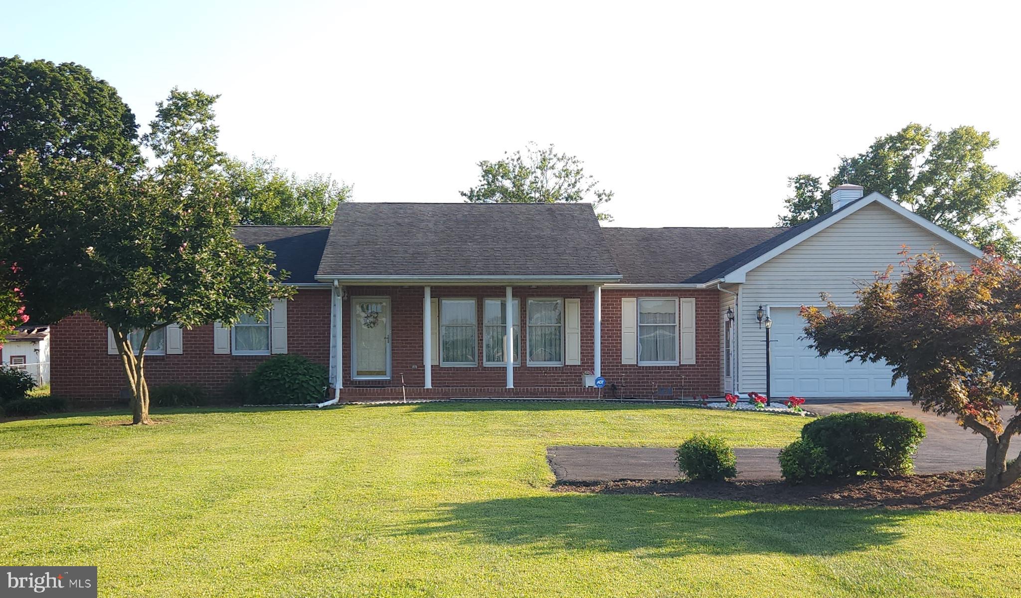 This beautiful brick-front home is nestled in a quiet, established neighborhood. Conveniently located just minutes from the Virginia line and I-81, this home is perfect for commuters and close to shopping, dining, and local activities.
This home has enduring craftsmanship and is built solid. The hardwood floors and crown molding add that special touch of timelessness. The classic brick exterior offers lasting durability with a welcoming look.
The main living areas and primary bedroom feature elegant hardwood floors, while cozy carpeting adds warmth to the additional bedrooms and front rooms. The kitchen and bathrooms are finished with vinyl flooring.
Enjoy outdoor living on the brand-new rear decking, perfect for relaxing or entertaining guests. Inside, you'll find a thoughtfully designed layout featuring a spacious sunroom, a dedicated pantry eat-in kitchen, formal dining and living room, family room, and a generous laundry room for convenience.
Additional features include ceiling fans in the living room, sunroom, primary bedroom, and a second bedroom, electric lighting in all closets for added convenience, a 12-year-old roof in excellent condition, a new hot water heater, water softener, and an HVAC system installed just 2 years ago, offering energy-efficient comfort. There is a security alarm system and a safe that convey.
The fenced backyard provides a private, secure space for outdoor enjoyment and includes a large outbuilding—perfect as a shed, workshop, or extra storage.
This well-maintained home offers everyday ease and lasting peace of mind. This is move in ready and a home you can truly make your own.
