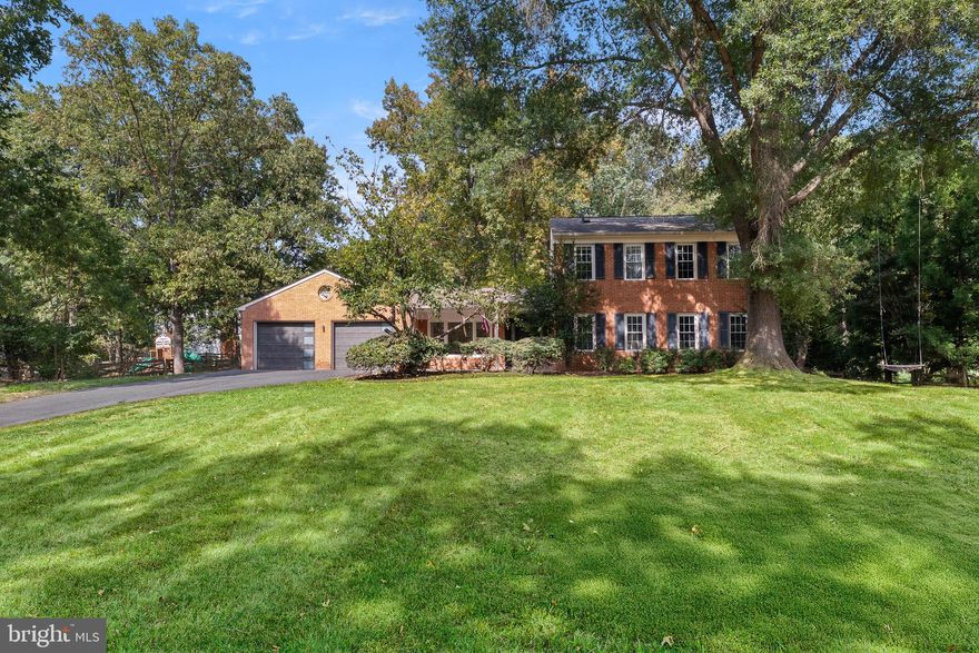 Extensively updated 4 Bedroom/3.5 Bathroom home on a spacious 0.59-acre lot in the heart of Holly Knoll! This move-in ready gem features traditional and modern upgrades throughout, including a newer roof (2020), french drain (2021) fully finished garage with storage closet and oversized rainfall shower, modern charcoal black garage/front doors (2025), LVP flooring, recessed lighting, custom wainscoting and dentil molding, and designer touches throughout. 

The open-concept gourmet kitchen impresses with stainless steel appliances, an extra wall oven, craftsman wood range hood, ceramic backsplash, built-in china cabinets, and island seating. Relax by the white-washed wood-burning fireplace (2025) or entertain in the light-filled living areas with contemporary wall panels (2024) and LED lighting overlooking the sliding glass doors onto the backyard patio. Other upgrades include an open concept foyer, renovated main level powder room, Nest thermostat, home security camera system, Mudroom with 2024 LG side by side washer & dryer features backdoor to patio. 

Upstairs, enjoy a luxurious primary suite with custom spa-inspired bathroom that boasts luxury black floor to ceiling tiles, LED smart mirrors, dual vanities, frameless oversized shower, soaking tub, and a custom walk-in closet conversion. Additional highlights include a front porch with recessed lighting, fully finished garage with mini split and oversized floor to ceiling shower, large backyard with mature trees, two patios accessible from mudroom and living room, sump pump, opened living room with beam, marble porcelain tiles,  crystal pendant lighting, large driveway and more!

Conveniently located off of Route 7 and Algonkian Parkway, nearby  Lowes Island, Tysons Corner, Dulles Town Center, Cascades and Sugarland Crossing.