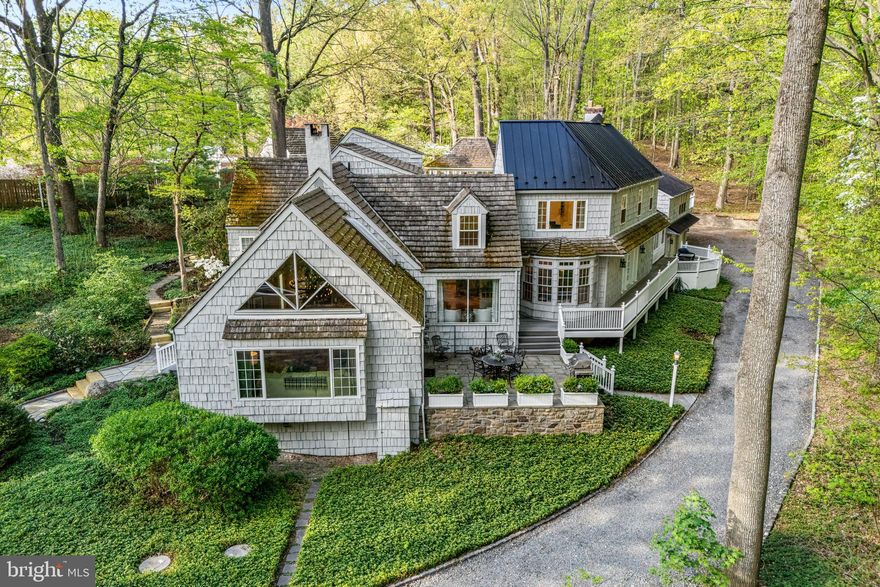 Welcome to 2959 Burnt House Hill Road, a distinctive and inviting manor-style residence set on 4.8 picturesque acres in desirable Buckingham Township. This serene and exceptional property offers 5 bedrooms, 5.5 baths, including a private attached in-law suite, providing remarkable flexibility for multi-generational living and guests.

Upon entering, you’re greeted by beautiful hardwood floors, quality finishes, and thoughtfully designed living spaces that seamlessly blend comfort, versatility, and functionality throughout the home.

At the heart of the home is the well appointed kitchen, featuring a center island with seating, double ovens, built-in range, and an oversized walk-in pantry, all creating a warm, inviting space ideal for both everyday living and entertaining. As part of the kitchen, you will encounter a lovely sitting area in front of an oversized window, offering serene views of the surrounding woods. Additionally, a breakfast area is wrapped in windows and leads to the trex deck and patio, further enhancing the connection to the outdoors

Just off the kitchen is the sun-filled family room that boasts a vaulted ceiling, a striking triangular window above a newer Pella picture window, and a dramatic stone wall fireplace that adds warmth and architectural interest. The spacious dining room with views of the cabana through the bay window, features multiple built-ins, a second fireplace as its focal point, and is perfect for memorable dining experiences.

Also on this wing of the home is an updated powder room and a year round sunroom with vaulted ceilings, wraparound porch, and access to both the rear yard and the attached second-level in-law apartment. The recently updated private in-law apartment includes a separate bedroom, full bath, full kitchen with newer stainless steel appliances, and a living/dining area with luxury vinyl flooring. This is ideal for extended family or private accommodations.

The main home offers four additional bedrooms providing exceptional flexibility. The primary suite is located on the second floor, featuring European white oak plank flooring and serves as a true private retreat. The fully renovated ensuite bath includes an over-sized glass-enclosed shower, separate vanities, a luxurious soaking tub with waterfall feature, and a private water closet. An expansive walk-in closet with custom organizers, built-in ironing board, and a window completes this impressive space.

The second bedroom offers its own private retreat with a large lounge area, full bath, and oversized bedroom with a triple-window with built-in bench seating. An additional hobby or office nook provides valuable flex space, while a walk-in storage area completes the second level.

Two more bedrooms and an office are located on the main level. One bedroom showcases vaulted ceilings and large windows overlooking the backyard, while the other bedroom showcases an en-suite bathroom with a steam shower for a spa-like experience. Both bedrooms include closets with custom built-ins. There is a hall bath that offers a jetted tub/shower. Lastly,  the convenient laundry room on the back side of the kitchen with additional storage space along with the full basement, are a great place for storing those items that are not needed on a regular basis.

The outdoor living spaces are designed for entertaining, relaxation, and year-round enjoyment of the nearly five acres of natural beauty. Highlights include an in-ground pool, pool house with bar area, a massive gazebo with an oversized hot tub, multiple decks and patios, beautifully maintained gardens and grounds, and a 3 car garage with extra storage along with extensive parking.

Located within the award winning Central Bucks School District and just minutes to Doylestown Borough with its shopping, restaurants, and historic sites, with convenient access to New Jersey, New York, and Philadelphia, makes this property a rare find. Don't miss this chance to make it your new home today.