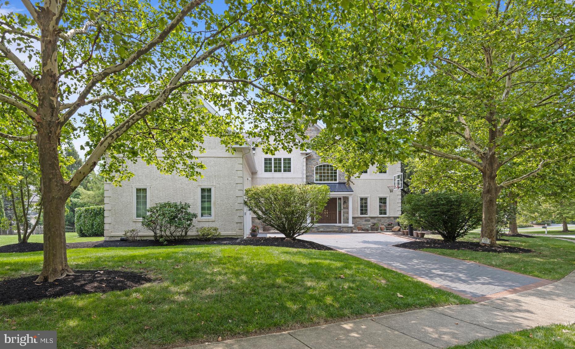 Welcome to 508 Doral Circle, a beautifully updated home in Berwyn offering a floor plan that blends open, light-filled living spaces with private retreats. You’ll love relaxing in the newer Sunroom addition, which has a vaulted ceiling and gas fireplace—perfect for relaxing year-round. Step outside to enjoy a rear deck with a built-in grilling center and a side patio with a cozy firepit, ideal for outdoor entertaining. The soaring Entrance Hall opens to the Living and Dining Rooms. The Kitchen has stainless appliances, including gas cooking with a built-in exhaust hood. Enjoy casual everyday living with open views to the Breakfast Room and Family Room. TWO offices provide great space for working from home. The second Office is upstairs and could also be used as an upstairs Sitting Room, homework room, or even a 5th Bedroom. A spacious Primary Bedroom Suite with en suite Bathroom and 3 more Bedrooms with 2 more full Baths complete the 2nd floor. The finished lower level is a showstopper, with gleaming wood floors, a spacious recreation room, built-in bar area, and a 4th full bath. The Mudroom/Laundry Room and large walk-in Pantry are located near the 3-car Garage. Recent updates include new heat/air conditioning (2018), water heater (2024), covered front porch and stone cladding (2021), and the rear deck, patio, & sunroom (2020). Ample space for outdoor recreation on the adjacent greenbelt of neighborhood open space. Tucked away on a quiet, no thru-traffic street, this home is just minutes from shopping, restaurants, clubs, and Paoli Train Station, which offers express AMTRAK service to NYC. The classic floor plan, inviting indoor-outdoor spaces, and neutral décor make this a standout property in award winning Tredyffrin-Easttown School District.