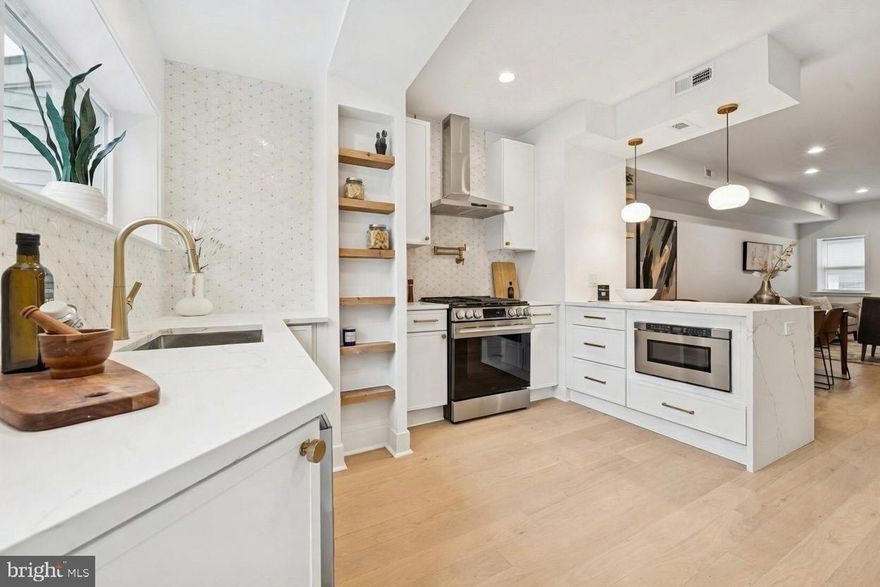 Step into 1019 Ellsworth Street—your dream on Philadelphia’s premier Passyunk Square block. This HIGH END FULLY RENOVATED  four-bedroom, three-bath stunner blends timeless exposed brick with modern magic: open-concept main floor, soaring natural light, and a jaw-dropping glass railing that frames every room. Second floor: two bedrooms, full bath. Third: first you’ll spot the luxury wet bar—mini-fridge, sink—leading straight to a covered indoor-outdoor patio. Laundry’s right there too. Then the luxury master suite: exposed brick, wooden shelving, electric fireplace, plus a huge walk-in closet that opens straight into a spa-like bathroom. Finished basement: Fourth bedroom + full bath, plus multiple smart storage areas. All closets custom-built, 10-year TAX ABATEMENT, JACKSON-COPPIN schools. Move-in perfection—rare, refined, and ready for you