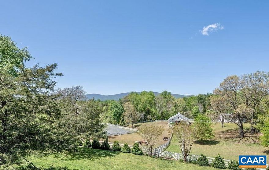 Fenced pasture with 2 run ins and water.