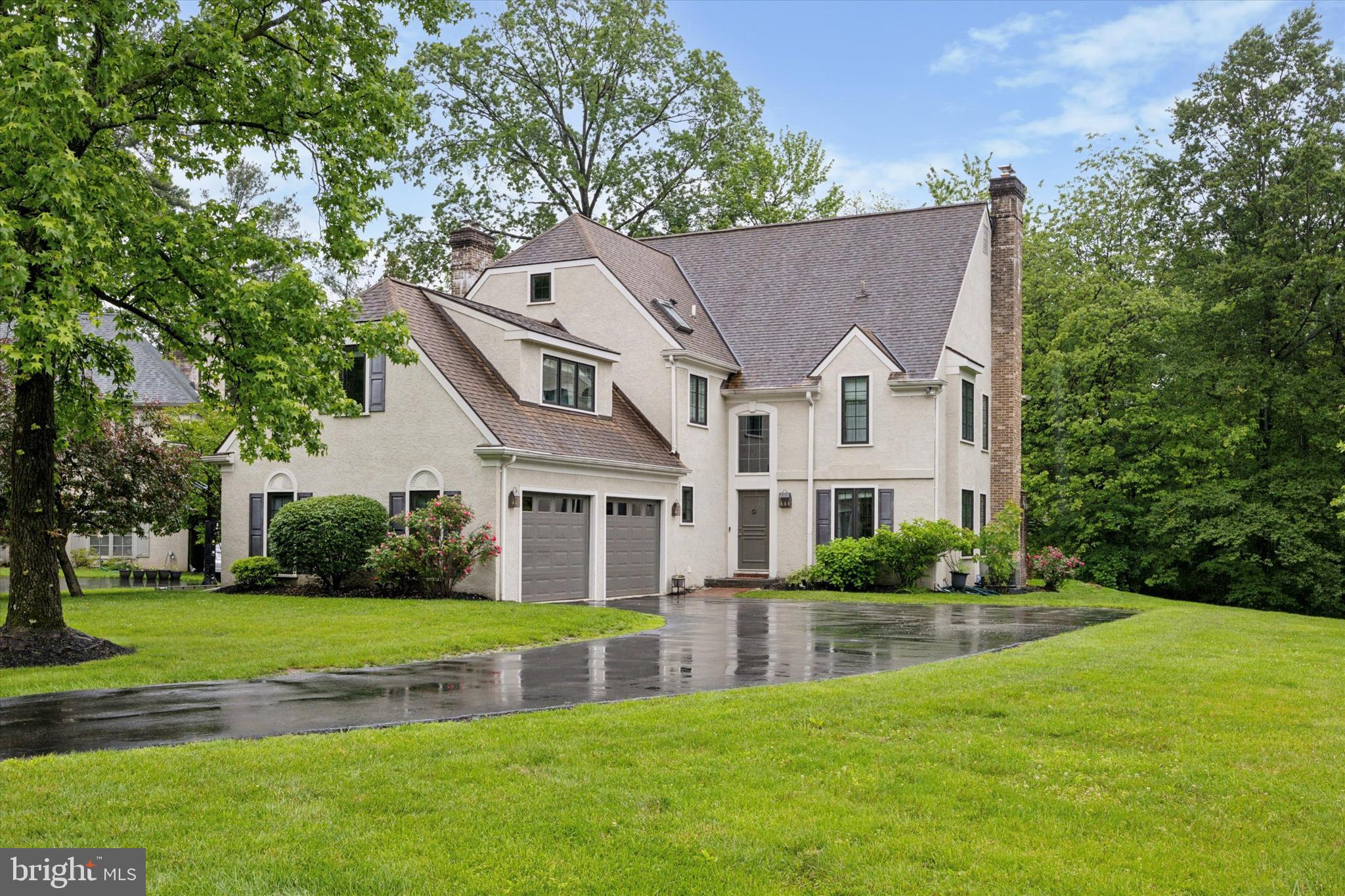 Welcome to 237 Trianon Lane — a beautifully updated home nestled in the heart of Villanova, within the award-winning Radnor School District. With over 3,400 square feet of living space on the first two floors, plus a finished basement, this 5-bedroom, 3.5-bath home offers the perfect blend of classic charm and modern convenience. Step inside to find gleaming hardwood floors that flow throughout the main and upper levels. Just off the foyer is a spacious home office complete with built-ins, ideal for working from home or tackling homework in peace. The formal living room, featuring a gas fireplace and abundant natural light, opens seamlessly into an elegant dining room—perfect for hosting family and friends. The heart of the home is the renovated kitchen, where a wall was removed to create an open-concept layout. Enjoy a large center island, granite countertops, stainless steel appliances, tile backsplash, and ample cabinetry. A sunny breakfast area opens to the inviting family room, while an all-season sunroom just off the kitchen offers a cozy spot for your morning coffee or a good book. Also on the main level is a thoughtfully designed mudroom off the two-car garage and a stylish powder room. Upstairs, four generously sized bedrooms offer great closet space and flexibility. On one side, two bedrooms share a beautifully updated bathroom with double vanity and designer finishes. Down the hall, two more bedrooms share another chic full bath with quartz countertops and a tiled stall shower. At the end of the hallway, the luxurious primary suite awaits. This spacious retreat features a renovated ensuite bath with heated floors, spa-style shower, dual custom vanities, Toto bidet, and a built-in bench. A versatile bonus room—currently outfitted with built-in cabinetry—offers the perfect space for a dressing room, nursery, or second office. A large walk-in closet completes the suite. The finished basement adds even more living space, ideal for a playroom, home gym, or game nights. Outside, enjoy a private backyard with a flagstone patio—perfect for summer barbecues—and a swing set ready for play. Located within walking distance to Villanova University and downtown Bryn Mawr, with easy access to major roadways and Center City Philadelphia, this home offers the best of Main Line living. Don’t miss the opportunity to make 237 Trianon Lane your forever home!