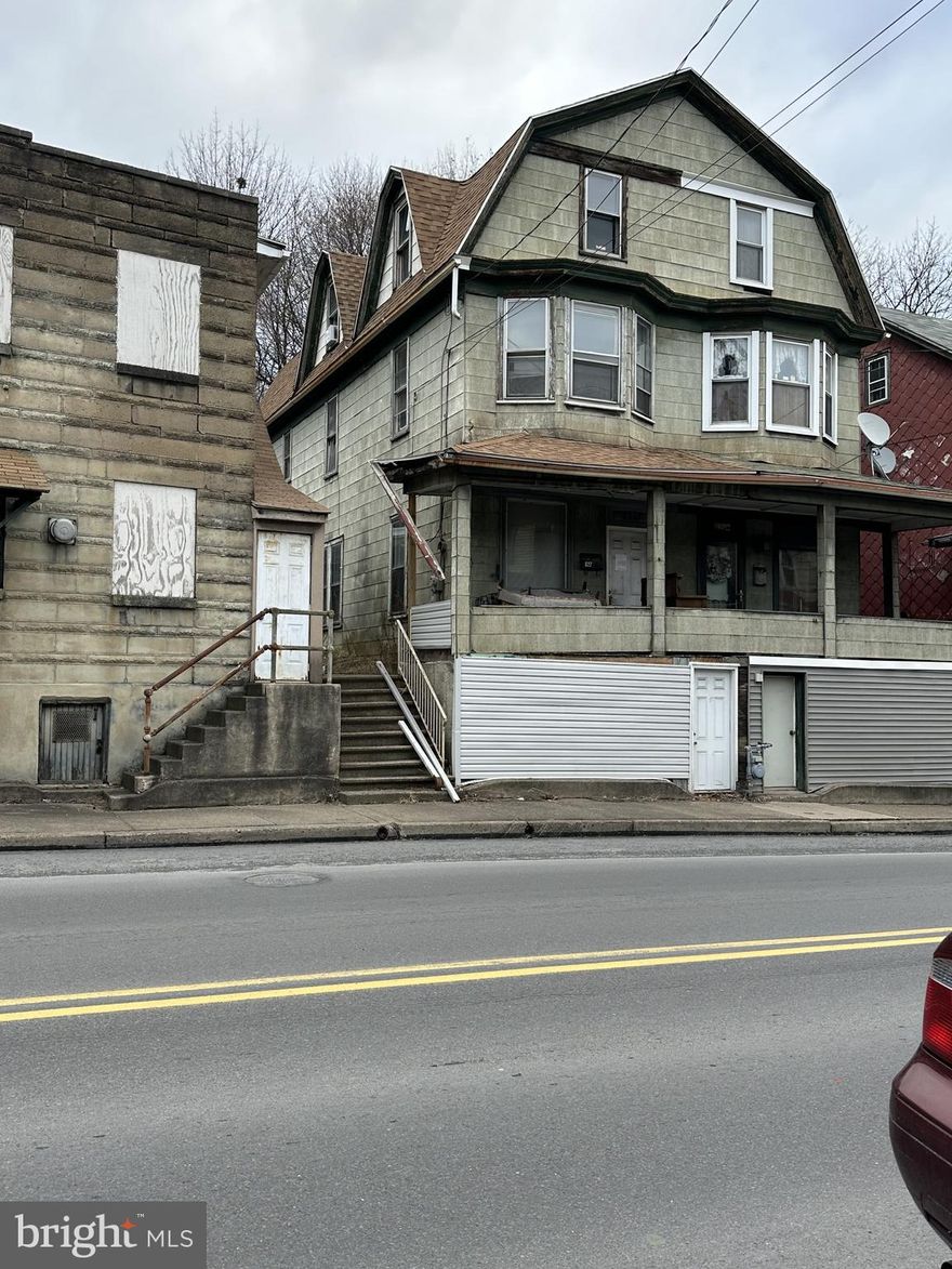 This property has so much potential! The home is nestled in the outer downtown area of Shamokin.  Spacious living area on the first level and original wooden floors throughout. The back door in the kitchen opens to a unique backyard, which can also be accessed from a side road leading to the back of the property, for off -street parking.  Two large bedrooms plus flex room on 2nd level, and three bedrooms on the 3rd floor.  Roof replaced in 2022. This large house is waiting for you to make it a home. Come check it out!