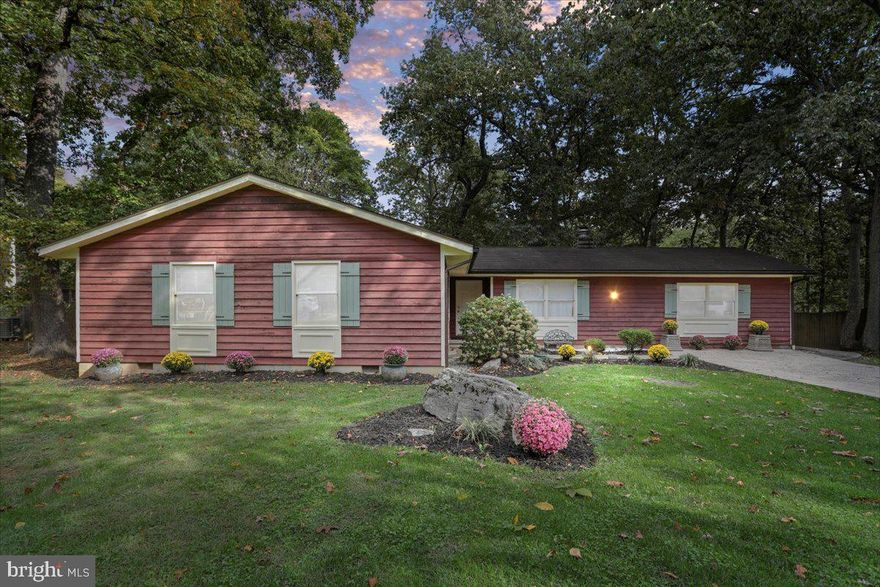 One Level Living at its Best! Uniquely Private lot with a large deck and patio overlooking mature trees, exposed rock ledges backing to woods for true relaxation! This ranch home features four bedrooms three bathrooms, with a living room, family room, dining room, and kitchen. The fourth bedroom could easily be transformed into a full In Law Suite with separate entrance. Lots of recent upgrades with fresh paint, LVP flooring, countertops, stainless appliances, and all three bathrooms remodeled. Positioned in a great commuter location with easy access to Interstate 81, City of Martinsburg, Medical services, WVU East Hospital, shopping & restaurants! Call For Your Private Viewing Today!