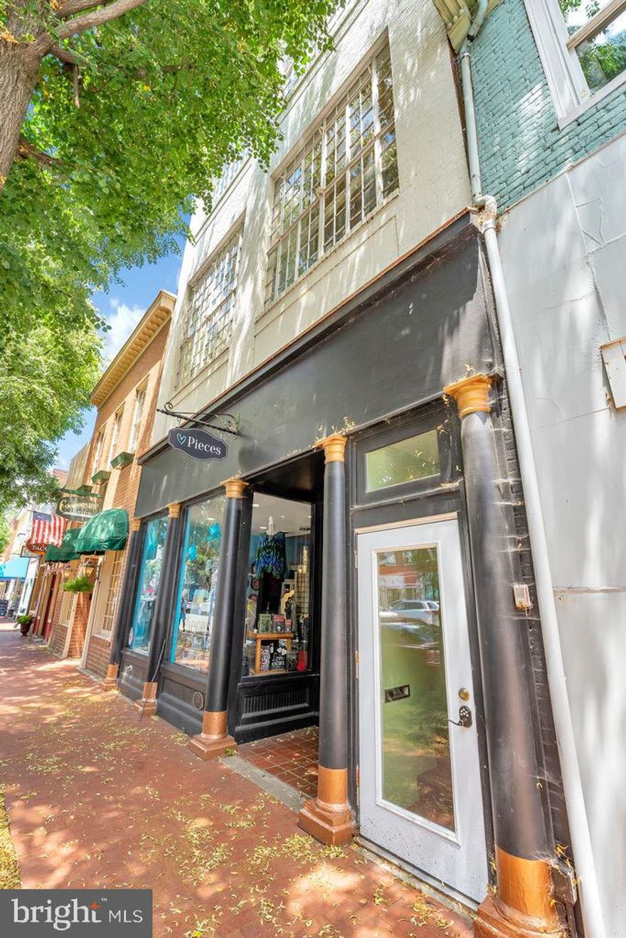 Imagine owning this iconic building in the heart of the historic district! This building is one of the grandest, most beautiful buildings on Caroline Street. There's street-level retail that was home to PYE &Co and is now home to Pieces, a shop for unique and handmade gift items. The property also offers four apartments and a full, unfinished basement. The 3rd-floor apartment spans the entire building with commanding views of the Rappahannock River and bustling Caroline Street. 
Located in CD Zoning, there's a potential to add on to the property in the rear. The property line extends about 40 feet beyond the back of the building. There's currently off-street parking in the back, but it could become a garage, addition, etc. 
Three of the four apartments are occupied. The current gross annual income is $97,200. The NOI is $82,434, with significant upside potential in the revenue.  Download the OM in the documents section for more information.
