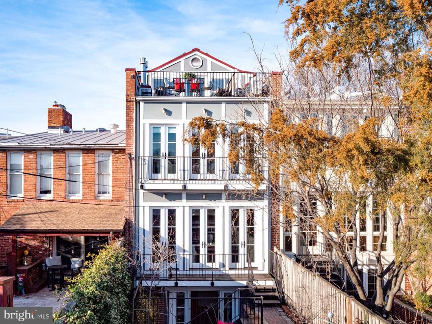 633 A Street is a masterpiece - an inspired design orchestrated $1M+ gut renovation of a gracious turreted Victorian beauty with over 3,500 sq. ft. of living area in a most coveted LOCATION. 

No expense was spared, No refined detail overlooked, No corners cut, No compromises on quality. ELEVATOR serves all 4 floors.

The four levels of South facing walls of glass, multiple skylights plus other inventive light sources flood all of the interior space with natural glowing light creating an airy ambience unlike any other vintage property.
The vestibule entry leads into the open floor plan - The LR, DR, Kitchen, and family room all flow sequentially through the house leading to a balcony, walled garden, and 2+ car garage. The garage is approached via the nicest brick alley on Capitol Hill (named Browns court) making this a pleasant walking shortcut to Independence Ave, Eastern Market, Metro, and all the best amenities the Hill has to offer. You are located on “THE” quiet tree lined street smack in the epicenter of national government and community life. 

Any Cordon Blu Chef will feel right at home in this perfectly setup Gourmet kitchen (3 dishwashers, 3 sinks, 2 refrigerators, baking oven, steam oven, pantry, and lots more) for preparing and serving food and drink for any size or type of gathering. The sleek cabinet-lined butcher block topped center island can fit 5+ people for casual dining. Masterfully crafted for optimal functionality for your entertaining and cooking. 

The 2nd floor opens to an inviting library/games room with lots of built ins and storage. The front bedroom and bath have rounded bay windows, smart storage, and a string of clever eyelash windows. 
The master bedroom suite has a fireplace, French doors, Juliette balcony, walk-in closet, fascinating skylights, and a bathroom with dual sinks, walk-in shower, laundry, separate tub and separate W/C. 

The third floor is a showstopper! It is an eloquent homage to contemporary architecture - a visual feast of shapes and views!  In addition to the open office/flex space and fully equipped conservatory (or extra bedroom), there are 2 sublime walkout decks. The north facing private “turret” deck has unique eyelash windows and a wrought iron peephole view of the Capitol! The large southern deck has a panoramic glimpse of the city and seasonal views of the capitol. 

Details throughout this home prepare you for this subtle blending of the modern and the traditional. There are no jarring discordant notes - it’s a harmonious symphony pleasing to the eye and the needs of current lifestyles.

The lower level is accessed by the elevator (and front and back outside entry). There is a bedroom and bathroom in the rear. It has exposed brick, built-ins, floor to ceiling windows, private patio, and laundry room.  The rest of the lower level is another ensuite bedroom or a large separate rentable apartment. 
All the rooms in this house have multiple options of functionality to suit any need.
The large garage has a work bench, water, electric and a wall of glass facing the house and inteior.  There is the potential for the creation of a 2nd floor auxiliary dwelling unit above the garage.
 
No expense was spared, no refined detail    overlooked, no corners cut, and no compromises on quality. This is not a developer’s product! 3 room-heating fireplaces, 3 laundry areas, disguised electrical receptacles, smart storage, and a staircase that unites modern flare and traditional elegance. 

This is a very impressive property in a most coveted location!