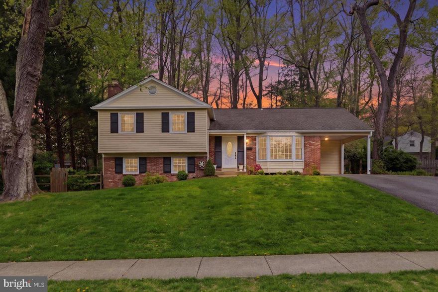 Open House THURSDAY 5-7pm and SATURDAY 1-3pm. Welcome to a well-maintained and nicely appointed home on a lovely lot boasting landscaping and mature trees. As you enter the home through the covered portico, the freshness of neutral paint and the sun-filled open floorplan invites you in. The kitchen is the heart of the home and this one delivers! A sunny breakfast area is anchored by a large bay window and features a brick accent wall and exposed wood beam detailing. The kitchen has been updated with Quartz countertops, stainless steel appliances (2026), and wood floors. A side door connects to the covered car port.  From here, the rest of the main level offers  an abundance of space for entertaining with a formal dining room, an ample sized living room boasting a large picture window, and a sunroom off the kitchen that connects to the deck and back yard through double French doors. The upper level of this home continues with hardwood floors and features a primary suite with an updated full bath, three additional bedrooms and a hall bath. Down to the first lower level, a large and welcoming family room showcases a cozy brick hearth fireplace converted to convenient gas and features LVP flooring and recessed lights (2025) along with a 5th bedroom, half bath, laundry area and side door to access the back yard. One more level down to a fantastic sized den, ready to be a game room, home gym, play room or home office.  A storage area and utility room complete this level. The fenced back yard of this home features a large deck and paver path that leads to the landscaped yard ready to bloom for you while mature trees provide privacy. Conveniently located just outside the beltway and steps to commuter bus stops, as well as shopping, dining, parks and more.  Major improvements include: HVAC (2025), Exterior painted (2026), Roof (2019), Kitchen appliances (2026), Quartz countertops kitchen (2026), Ductwork professionally cleaned (2025), Hardwood flooring on upper level, stairs, living room, sunroom, kitchen (2025/2026), LVP flooring in dining room, both lower levels (2025/2026), Complete remodel primary bath (2025). Pool/Tennis membership/bond to Wakefield Chapel Recreation Association transfers to new homeowner (paid for 2026). Agents: detailed showing/offer information in Agent Remarks & Documents Section for your convenience. THANK YOU!