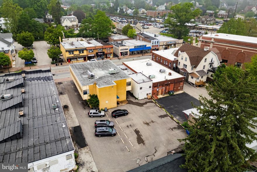 Prime Office Building with Parking, and  multiple tenants renting space. Located in the Heart of Glenside’s Business District. Outstanding opportunity to own a spacious, well-maintained commercial office building in one of Glenside’s most vibrant and visible locations. Ideally positioned in the bustling downtown corridor, this approximately 7732 sq ft property includes a private lot with 25 parking spaces—an exceptional asset in this high-traffic area. Just one block from the Glenside SEPTA regional rail station and steps from a major bus stop, the building offers unbeatable commuter accessibility. The first floor and lower level are fully leased, generating immediate rental income across seven office suites. You can reconfigure the spaces to get more or less rental units out of the current layout. The bright, second-floor space is perfect for an owner-user or to attract new tenants. Key features include: Updated HVAC systems, Excellent natural light throughout, Prominent signage visibility along Easton Road, surrounded by popular restaurants, shops, and a thriving residential community. Walkable, convenient, and primed for long-term appreciation, this property is a smart investment for professionals, business owners, or investors seeking a strong presence in Montgomery County’s sought-after Glenside market. Don’t miss this rare chance to secure a standout location in Glenside’s business hub.