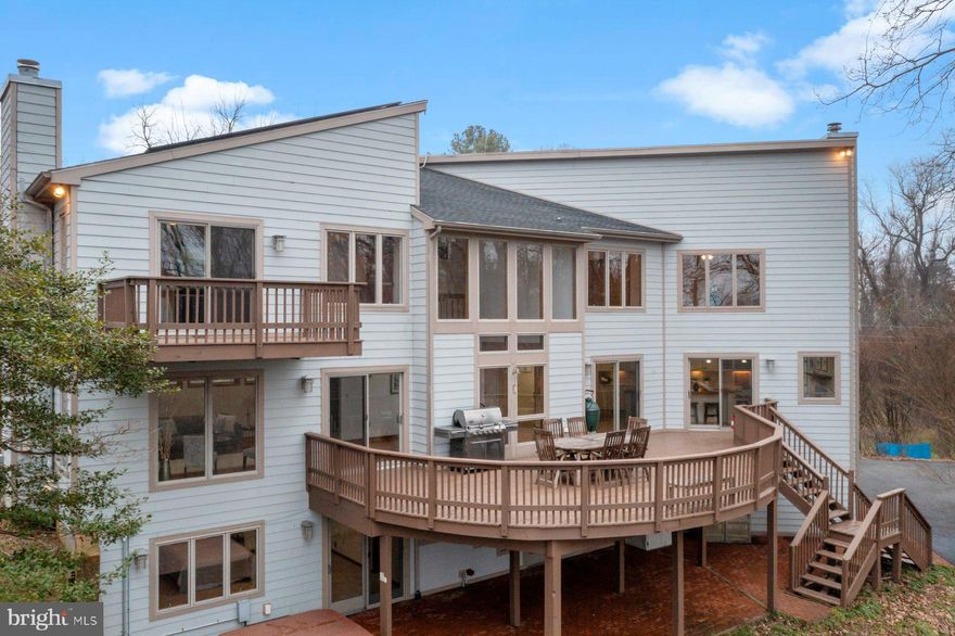 Awesome WATERFRONT PROPERTY
NEW PRICE:  $1,500,000
Fabulous water views from every room in the house! 1.97 acre property *Private and secluded waterfront with 271 feet of water frontage ( hard to find) .  Private sandy beach and lots of extra lawn space for volleyball, corn hole and waterfront bon fires* *  8 ft mean low water, bring your big boat * Pier with 4 boat slips/ including (2) 15,000lb lifts (1) 30,000lb lift. *  Pier has water and electric * Large waterside, storage shed with electric * Kayak Rack *  Boat trailer storage * Graded trail from house the waterfront/ drive your golf cart down * 
Home has 3709 sq. feet of living space * 2 Master bedrooms one on the 1st floor and one on the 3rd floor* The 1st floor Master has it's own entrance to the outside.*Soaring 2-story ceiling in the dining room /fits table for 8-10/ floor to ceiling windows * Sub zero fridge *Viking  stove * Kitchen island w/ seating for 6 * Wood burning fireplace in kitchen * Sliding doors to deck * Dining room fits table for 8-10, more water views *Living room with floor to ceiling windows that have awesome water views, wood burning fire place*
2nd Master Bedroom on 1st level w/ walk out to brick patio * 1st level family room with access to brick patio.
Solar panels owned by sellers * Energy stored in TESLA batteries that provide electric for Electric Vehicle charging station, lowers homes energy bills, and kicks  on to provide electric in case of a power failure.
Level 2 Electric Vehicle Charging station w/ 220 volt.
Lawn Irrigation system, several storage sheds.