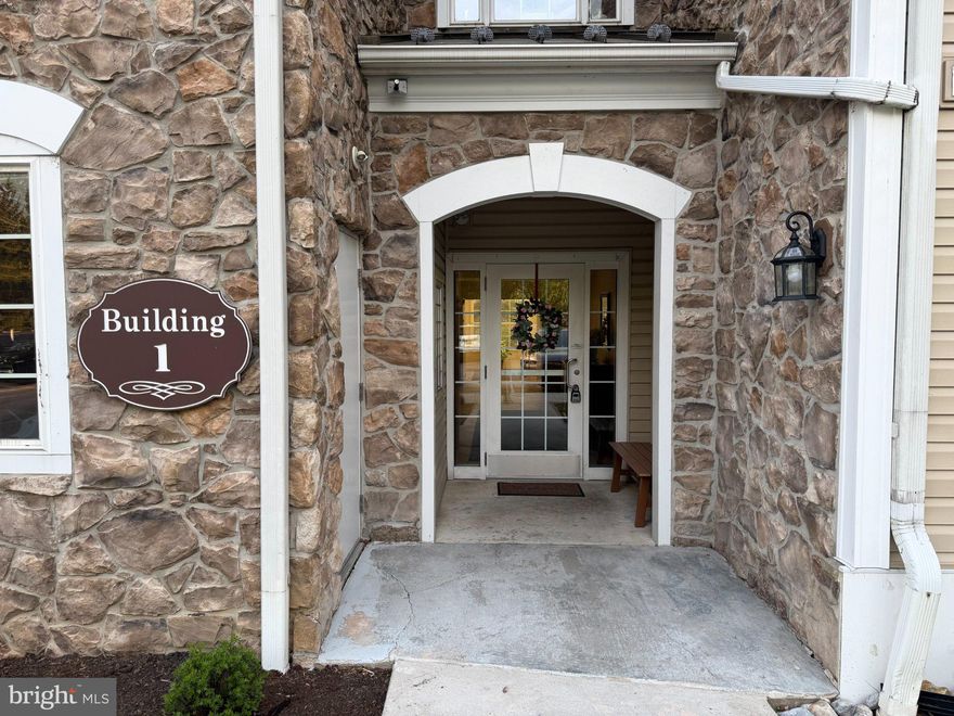 Welcome to Traditions at Ridley Creek—an established condominium community offering low-maintenance living in a convenient Delaware County location. This bright and spacious second-floor unit features 2 bedrooms, 2 full baths, and a versatile den or office, and is freshly painted and move-in ready. 
An inviting foyer with wainscoting and crown molding opens to a well-designed layout with hardwood flooring throughout the main living and dining areas. The kitchen offers granite countertops, ample cabinetry, and a breakfast bar, flowing seamlessly into a large dining area and expansive living room—ideal for everyday living and entertaining. Refrigerator, washer, and dryer are included.
There is a den/office offering additional privacy, while both bedrooms offer comfortable space and generous closets with additional storage. Bathrooms have been updated, and major systems—including HVAC and water heater—have been replaced, offering peace of mind. A pre-listing home inspection is available for buyer review.
Enjoy a private balcony with peaceful views and easy access to parking. With central air, gas heat, and a convenient location near shopping, dining, and major routes, this home delivers comfort, functionality, and easy living in a well-maintained community.