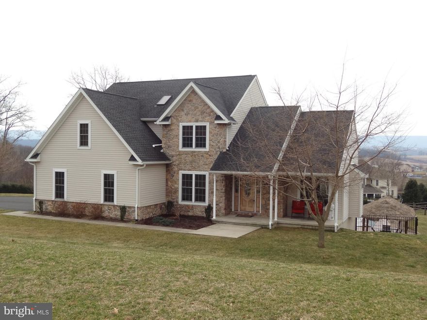 Beautiful 4 bedroom, 3.5 bath home in Rolling View Estates. Easy access to Routes 61, 183, 78, and 81. If you love to cook or just need a lot of counter space, this cherry Medallion 46-handle kitchen has built-in wine fridge, two lazy suzan cupboards, pantry storage, and both a stove and a wall oven for extra cooking space.  Granite counters, under cabinet lighting, and counter bar eating space for 6 make this kitchen a must have.  The breakfast nook area looks out over spectacular mountain views and also leads to the back deck & yard. Sliding glass doors in lower level lead to a large patio/pool area where you can relax and enjoy the mountain views while floating around in your in-ground, heated, salt water pool. Large patio area and Tiki Hut for outdoor fun and entertaining. Additionally, home has interior/exterior sound system on the first floor, lower level, and outside patio areas. Full bath in lower level for added convenience when entertaining poolside. New safety cover installed on pool fall 2018. Finished lower level has office area, family room, built in bar area, and a large storage/utility room.  LL also has a Keystoker 90,000 BTU coal stove for supplemental heating.