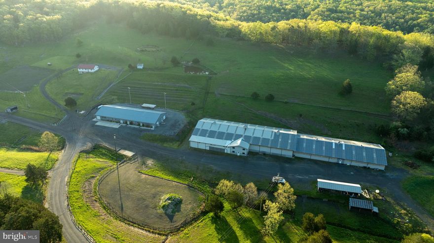 Equestrian Farm with Investment Opportunity

Welcome to the hidden gem formally known as Crystal Valley Ranch. This expansive property is spread out over 107+/- acres with features ranging from 3 ponds, multiple paddocks, a restaurant, saloon, dance hall, RV sites, massive indoor arena, stalls and so much more. 

Restaurant-Saloon-Dance Hall-Kitchen

This building with a rough footprint of 150x60 holds 4 separate rooms allowing for multiple functions and business opportunities.  A large kitchen (32x60) features multiple stoves, deep fryers, ovens, work space for preparation, a walk-in freezer/refrigerator, private bathroom and laundry.
The dining hall (60x40)has all the tables and chairs to seat incoming guests. This room offers direct access to the saloon next door, the stage out back or the large connected bathrooms. The Saloon (40x38) features a horseshoe style bar top layout with tables and chairs. All the glasses and TVs are still in place awaiting for the new owners. The dance hall (60x37) features 2 large pool tables and custom lighting that can be used for any event in case of inclement weather or overflow.

 Barn

The expansive barn stretches 365 feet from end to end with a 200x80 indoor riding arena complete with spectator chairs and second floor seating. The upstairs of the barn has a little apartment that would be perfect for a property manager or stablehand. In the lower section there is a direct entrance with office space, bathrooms and a ticket window for hosting events.
Part of this large barn are the stalls and living facility attached. Made up of 29 stalls that have individual saddle cabinets,  multiple water wells, a large bath area specifically for the horses and asphalt flooring to make cleaning that much easier. In the upper portion there is a small studio apartment that overlooks the barn making another fantastic location for a stablehand, horse trainer or ranch manager.

RV-Camper-Tent Sites

The northern portion of the property has been meticulously thought out and maintained for future campers, passer-by or RV travelers. The upper lot has 29 sites with water and electric and a sewer pump out location. Just west of this location there are 16 sites for pop-up tents that share water taps and all have individual electric plugs at each site. Downhill from there are 12 secluded camp sites with electric and water at each for those individuals looking for seclusion and being tucked into the woods.

Bath House

Between the tent/camping locations is a large 51x20 bath house that all campers can utilize.  They are separated for individual users

Home
The home has good bones and awaiting for someone to come in and make it their own. Upstairs is a large kitchen and living space with 2 bedrooms on either side. The basement is partially framed in with drywall up allowing for separated storage or put your own personal touch and finish it out differently.

Sewage Facility
Much of the property utilizes a private sewage system which has a clean finished product that drains out into the lower pond. The Barn  and restaurant utilize this facility with the RV/tent site and bath house using its own system.

Land
4 parcels make up this gorgeous 107.824+/- acres. The back 40 resides in Crystal Valley Ranchettes subdivision. This subdivision works in correlation with the WV DNR preserving the ground and the wildlife that live on it.  Multiple paddocks make up the fields allowing room for the horses to graze and guests to wander. Trails encompass the property that are perfect for horseback rides, hiking or hauling out firewood.

History
The property has a rich history dating back to the civil war and beyond. Located at the southern portion of the property just before the pond is a large cave meandering back into the hillside a mere 200 feet. This cave was used by the soldiers to mine and extract saltpeter which was a vital ingredient in making black powder.

Call today to schedule your very own personal showing.