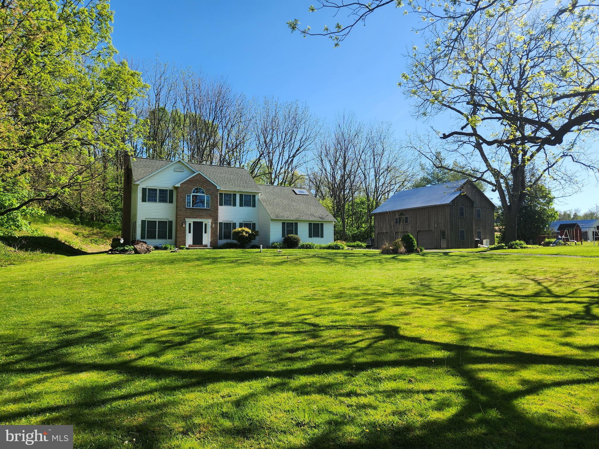 Welcome to your dream colonial-style home nestled in a serene and private setting. This stunning property boasts a generous lot with ample space for outdoor enjoyment and entertaining. A highlight of this property is the charming reconstructed 2-story barn, featuring three bays and abundant storage, perfect for indulging in hobbies, exploring business ventures, or simply storing your treasures.
Upon entering the home, you are greeted by an impressive 2-story foyer, setting the tone for the elegance and comfort found throughout. A versatile side room offers flexibility as a playroom or office, providing a secluded space for focused work or play.
The main floor is designed for effortless entertaining, with a spacious formal dining room and an inviting eat-in kitchen complete with a large island, ample counter space, and a convenient pantry. The powder room and laundry room are discreetly tucked away, ensuring uninterrupted enjoyment of gatherings and festivities.
The heart of the home is the expansive family room, featuring a wood-burning fireplace and triple windows that frame picturesque views of the rear yard. Sliders from the breakfast area lead to a two-tiered deck, creating an ideal setting for outdoor gatherings and relaxation.
Upstairs, a welcoming landing guides you to four bedrooms, each boasting impressive closet space for storage and organization. The main bedroom is a retreat unto itself, offering vaulted ceilings, double closets, and a spacious en-suite bathroom complete with a double vanity, large soaking tub, separate shower, and ample storage.
Outside, the rear of the property features a wooded area with a manicured walking trail, providing a private oasis for exploration and relaxation. Parking is never an issue with a huge driveway and an oversized 2-car attached garage, offering additional space for a work area and storage.
This home has been meticulously maintained, with updates including a newer roof, water softener, and hot water heater. With its lovely property and endless possibilities, this colonial-style gem is ready to welcome you home.