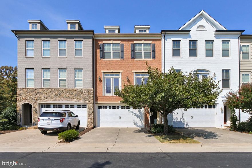 At approximately 3100 sq ft, this well maintained home is perfectly situated in a quiet enclave of homes across from the Silver line metro.  There's hardwood flooring in the foyer and in the main living areas, with upgraded berber carpet in the rooms and stairs.  The first level offers a  bedroom,  full bath and  the family room.  No stairs!  One floor up, there's the gourmet kitchen with 42" cabinets, granite counters and stainless steel appliances with family room off the kitchen, living and dining rooms.  On the upper 2 is the primary bedroom with tray ceiling, walk in closet and a bath with upgraded tiles and a separate toilet closet for privacy.  Two additional bedrooms and a full bath round out this level, and the laundry room is here for convenience.  The basement is fully finished and expansive with a walk out to the backyard.   There are many things to love about this home but first is the unobstructed views.  This home faces the common area and backs to trees for maximum privacy.  The second is the convenient location.  You can walk across the street to the Silver line metro, with an easy access to the toll road.  You are also close to the Brambleton Town Center with shopping, restaurants and two movie theaters.  Third is the plentiful visitors parking in front of the home.  Extra storage in the house, close to all major roads and much more!  Available for immediate occupancy.