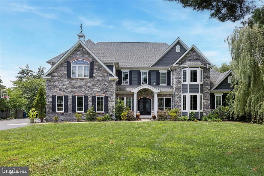 Custom designed home with golf course views!
This architect-designed 5 bed, 4.5 bath home was built in 2015 on a premium 1-acre lot overlooking the 7th hole of Paxon Hollow Golf Course, with unobstructed sunset views which was originally a lot premium—all with no HOA. Every inch of this residence was thoughtfully designed, from the expanded 3-car garage with epoxy floors and motion-sensor lighting, to the stone-accented façade and double-door entry that enhance its curb appeal.

Inside, the open-concept layout features high ceilings, Haiku fans, modern recessed lighting, and designer chandeliers throughout. The chef’s kitchen includes Sub-Zero and Wolf appliances, ceiling-height custom cabinetry, a large island, and a tile backsplash—perfect for entertaining.

Additional highlights include:
– Surround sound wiring throughout (pre-installed before drywall)
– Remote-controlled rear window shades
– Security camera system with full exterior coverage
– In-ground sprinkler system (front and back)
– Dual-zone HVAC
– Centralized media/tech hub in basement for easy control of internet, security, and audio

The primary suite offers a private balcony, spa-like bathroom, and home theater wiring, while the first-floor in-law suite features a private entrance, Jacuzzi tub, and its own pre-wired setup. The basement includes a Bilco door for exterior access and is pre-plumbed for a future bathroom, offering room to expand.

All of this is located just minutes from Route 3, Route 1, and I-476, Marple Newtown School District, and top conveniences including Lawrence Park, Broomall Commons, Nutmeg Shopping Center, Wawa, Home Depot, TD Bank, Main Line Health, and Fairfield Inn for guests.