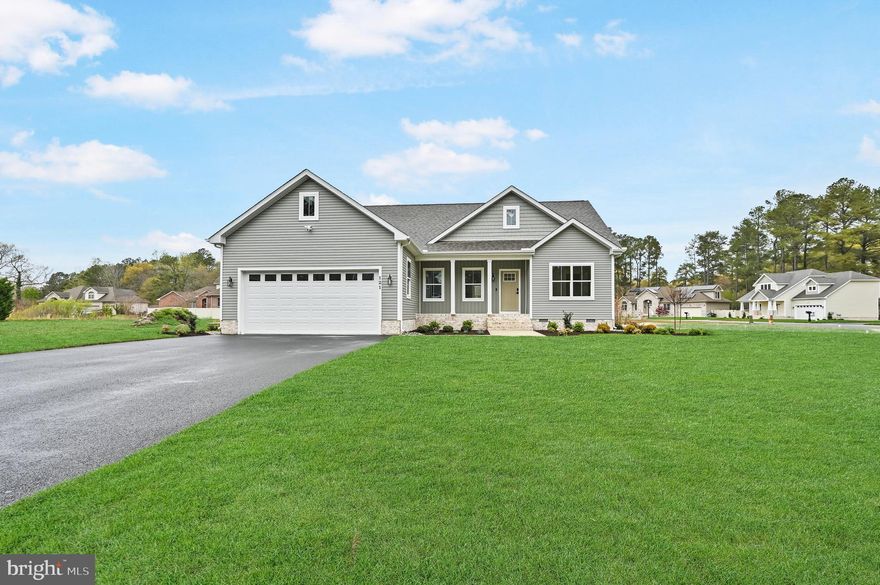 Welcome to this beautifully upgraded 4-bedroom, 3-bathroom home in Fruitland, MD, offering a spacious open floor plan perfect for modern living. The kitchen features an island, quartz countertops, Fabuwood cabinets with self-closing drawers, stainless steel appliances, and a stylish tile backsplash. The dining and living areas flow seamlessly, creating an ideal space for entertaining. The first-floor master suite is a true retreat, boasting a luxurious full tile shower and dual vanity sinks. Another bedroom and full bathroom with a tile shower is also conveniently located on the main level. Upstairs, you'll find a spacious bedroom with a walk-in closet and an additional full bathroom. Plus, an unfinished area provides ample storage space for your needs. Enjoy the outdoors on the TimberTech deck, perfect for relaxing or hosting guests. Additional builder upgrades include CertainTeed siding, IKO Cambridge shingles, MI V3000 series windows, insulated garage door, and a Ring Home Package. The trim package is upgraded to a stylish Craftsman design, and the home features durable LVP flooring with a lifetime warranty, wood shelving in closets and pantry, and tile accents throughout. Enhanced curb appeal is evident with a black top driveway and landscape bed package. This home offers both comfort and style, with quality craftsmanship and thoughtful details throughout. Schedule a tour today!