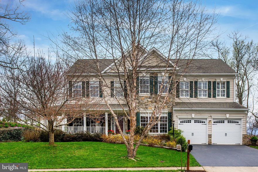 Super curb appeal!  This lovely home with an inviting front porch backs to woods and is ready to welcome a new family.  Five bedrooms on upper level, 2-zone HVAC and 9-foot ceilings on main and upper levels!  This immaculate home also features quartz countertops and subway tile upgrades in the island kitchen, a gorgeous stone family room fireplace seen from the kitchen, hardwood on most of the main level including the split staircase and upper hallway, library with built-ins and everyone's favorite--a private screened porch.  XL master suite includes a large bath with separate vanities and an amazing master closet storage system built by Tailored Living.  New paint and carpet throughout.  This turnkey home near the nature trail & creek is close to everything Downtown--parades, festivals, W&OD Trail, restaurants, post office and shops.  Walk to the high school and enjoy small town living!   See walk-through virtual tour to further explore this wonderful home!