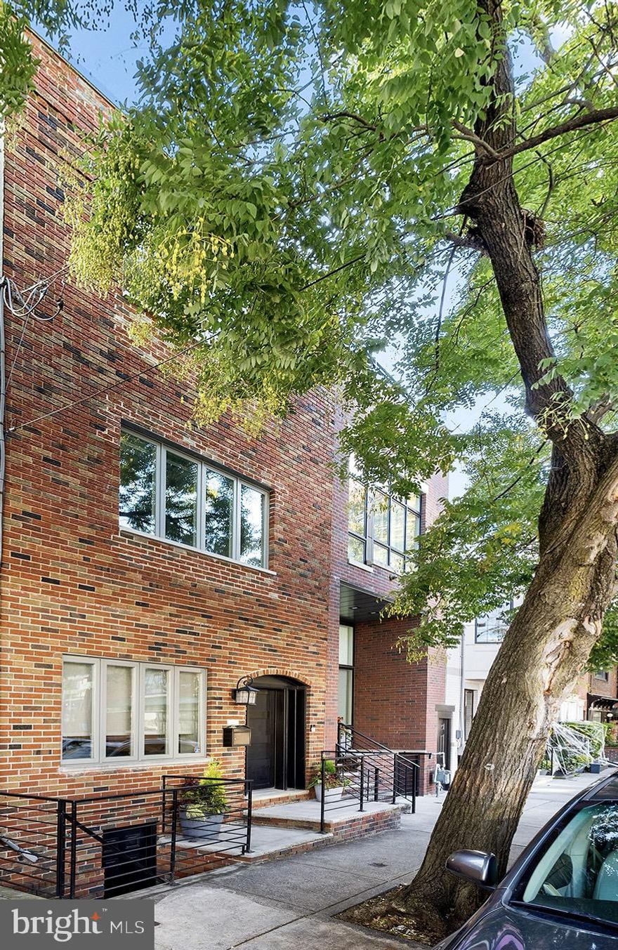 Ready to be wowed?! This is the one you’ve been waiting for! An amazing opportunity to live in one the most sought-after neighborhoods in the city, on a tree-lined block in Bella Vista with GARAGE PARKING. This extremely spacious, 18-foot wide, 3 bedroom + finished basement, 3.5 bath home with two large outdoor spaces is truly a unicorn. Exquisitely appointed and designed for relaxed, luxurious living and full-scale entertaining. Fabulous private outdoor space off the kitchen area blends to create masterfully executed indoor and outdoor living spaces. Pull into your private oversized garage and enter the home through the sizeable back patio complete with a built in storage closet, or enter through the front door into the oversized living room/dining room. Towards the back of the home is the well-appointed kitchen featuring marble counters, Sub-Zero and Wolf stainless steel appliances including a wine refrigerator, modern cabinetry, and a 11-foot island. Light fills this first level of the home via large windows in the front and sliding doors in the back. The second floor is comprised of two substantial bedrooms with custom closets, two full bathrooms, and a sizeable laundry room with built-in storage. The next level boasts the primary suite, and what a suite it is! Exceptional closet with custom built ins; luxurious primary bath comprised of a double vanity, stand alone soaking tub, glass enclosed stall shower, and linen closet; and huge bedroom with modern built-ins. While you are upstairs, be sure to check out the recently recoated, enormous roof deck with stunning views of Center City and the river. On the off chance this wasn’t enough space, wait until you see the basement with high ceilings, custom built-ins, tons of storage space, and a powder room. Additional highlights include smart lighting technology, whole-home wireless network, and electric shades. This home is a true gem in mint condition, located in the Meredith Catchment on a wonderful street away from the hustle and bustle of the city, yet walking distance to restaurants, coffee shops, and markets, and a stone’s throw from the best neighborhood parks and play grounds! Easy access to public transportation, and to highways and major arteries for those commuting. More than 4 years left on tax abatement. You will experience the very best of city living in this gracious home.