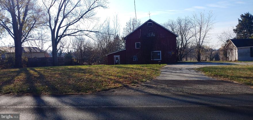 Do not pull into driveway without an appointment. Here is your chance to build your dream home in this highly desirable area, close to the 422 bypass, shopping, restaurants and schools. The original home burnt down around 10 years ago, the barn is original and has horse stalls, if a buyer wishes to keep it. The land is flat and goes around to the left in the back. There is a working farm behind this property and to the side so no other homes will be going to the right of the property or behind it. There is a well in front of the barn that goes down about 300 feet (needs to be confirmed). There is no public sewer at this location, although there was a leach field in the back that has been abandoned. The property goes about 2 feet on the other side of the fence.  Make your appointment today!