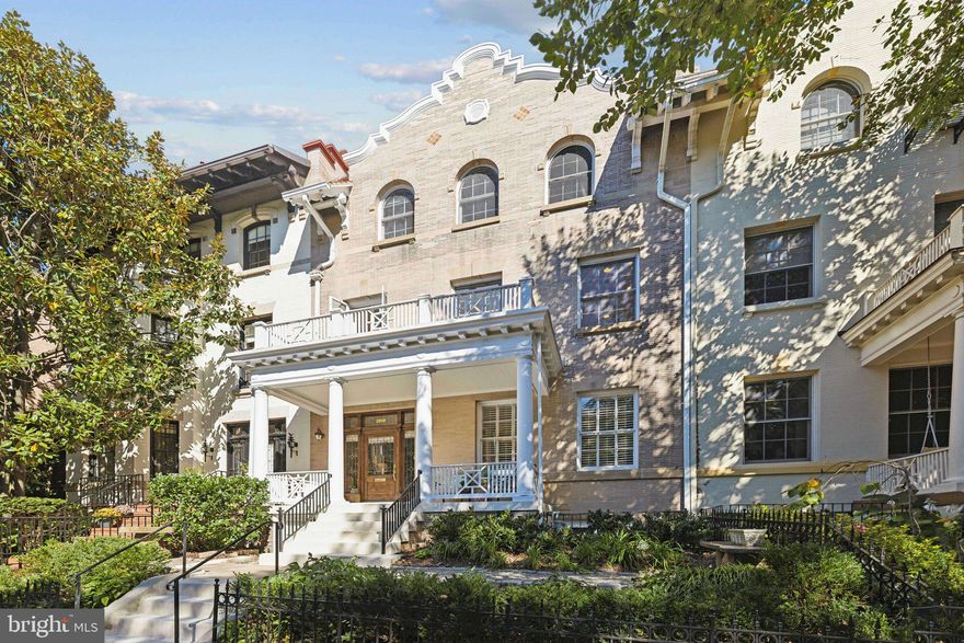 Welcome to 2619 Woodley Place NW—a stunning 6,500-square-foot residence that beautifully blends classic appeal and proportions with modern updates. Built in 1912 and set in one of DC’s most coveted neighborhoods, the home offers both inspiring spaces and the ease of living with everything you want at your doorstep. 

A large columned front porch invites you in through the leaded glass front door which opens into the grand entry hall with impressive moldings. A sweeping staircase, crowned by a skylight, fills the center of the home with natural light. High ceilings and oversized windows enhance the sense of space, while the rich hardwood floors and graceful moldings throughout exude timeless elegance.

The formal living room is anchored by a marble fireplace flanked by custom bookcases, flowing into the grand dining room with its own handsome fireplace. French doors lead to a serene, screened-in patio with skylights, ideal for relaxation. At the heart of the home is the expansive chef’s kitchen, outfitted with quartzite countertops, GE Monogram appliances, a six-burner gas range, and custom cabinetry. The adjacent breakfast room provides a cozy place to gather for casual meals. 

Upstairs, the primary suite impresses with a marble fireplace, custom built-ins, and a gracious walk-in closet.  The luxurious bath boasts marble floors, a glass-enclosed shower, and double vanities. An adjacent exercise room enjoys abundant sunlight. Two additional rooms serve as bedrooms or offices with one opening to the porch’s roof terrace through screened French doors. Open them to enjoy the breeze! A redone marble bath and hall laundry complete this level.  

The third floor offers four more spacious bedrooms and two exquisite marble bathrooms. A rear screened porch, shared by two of the bedrooms, provides a tranquil tree-top retreat. The lower level is a fully renovated in-law/au pair suite with a chef’s kitchen, two marble baths, a fireplace, its own washer/dryer, and a private terrace. 

Situated near Rock Creek Park, this home offers access to miles of trails and outdoor spaces, while restaurants, shops, and the zoo are just steps away. With three parking spaces plus the garage, you’ll have plenty of room for family and guests. The Woodley Park Metro Station is one block away, and renowned schools are also within walking distance. 2619 Woodley Place presents a rare opportunity to own a magnificent home in a prime location.