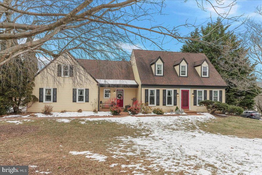 This lovely cape cod was built by EG Stoltzfus in the scenic neighborhood of Walnut Grove. Be prepared to be wowed with a first- floor primary bedroom suite, newer windows, newer septic and a large, beautiful screen porch that was added in 2018—the perfect spot to visit and relax while you overlook the amazing gardens and plantings! Front door welcomes you to the newly painted living room and dining area. Laminate floors and recessed lights are updates while the kitchen opens to the area for the popular floorplan of 2025. Newer stainless appliances, double sink and open display shelves combine with a butler’s pantry for food prep and party set out. Located off the kitchen is a laundry room and powder room for easy access from the yard as well as your domestic chores. French doors lead to the dramatic family room, complete with skylights, ceiling fan and a lovely brick fireplace with a propane stove---the perfect spot to gather around on a cool evening. Primary bedroom suite, on the main level, is waiting for you to relax after a long day. Walk in closet combines with a beautiful, updated bath that features a ceramic tile shower and double vanity with pendant lights. Upstairs will greet you with 3 additional bedrooms, hall bath and a walk- in floored attic area for your storage needs. Basement features a rec room, office area, craft area, and additional storage. Home updates include a new water treatment system, new septic in 2019, new windows in 2022 and a new well pump and whole house surge protector in 2022. After a long day stroll down the walkway in the back yard and gather around the firepit, that is nestled among the scenic gardens and feel like you are home!