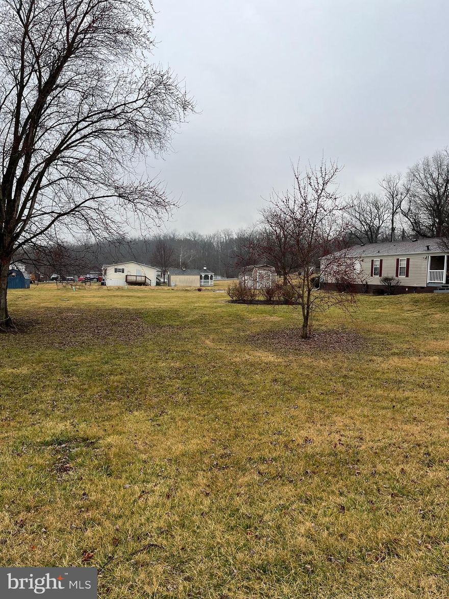 This is one special lot for a doublewide to make its home on.  No lot fee or HOA.  Plenty of room for a garage also along with a play area for your children.  You will not find a more private mobile home park that has space between the homes.  This is a must-see.  Don't let this one pass you by.  Spring Mills schools. Close to schools, shopping, I-81, and many conveniences.  This community has a community septic which this property already has a 1000 gallon tank on the property, which  would still need a 500 gallon tank placed on the property.  This also has public water line run for the property.