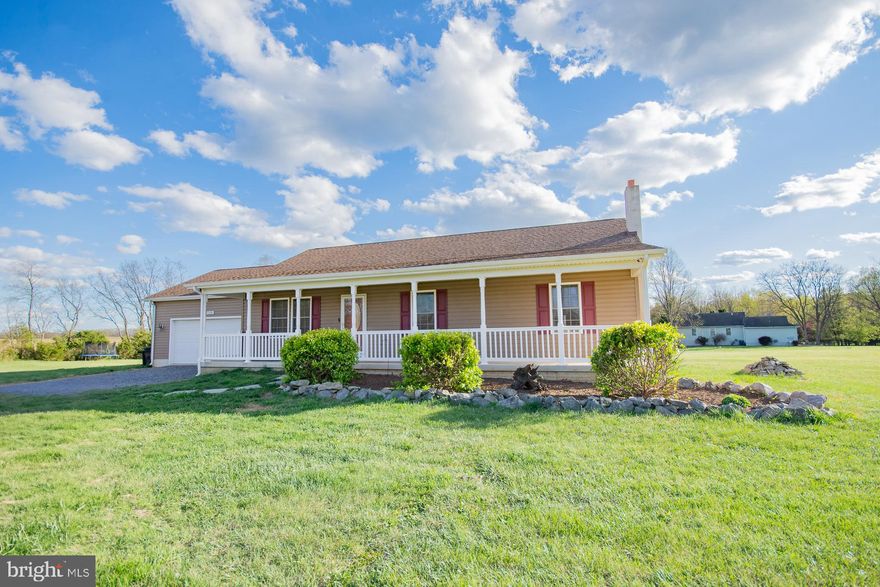 A RARE FIND!!! Looking for one level country living this is the home for you! Located on five acres, with lovely mountain and farm views. This Rancher with a 2 car garage offers 3 bedrooms, 2 full baths, open floor plan with living, dining and kitchen combo. Making this a great entertaining space or time for family togetherness. Kitchen has stainless steel appliances , granite countertops and cherry cabinets.  Primary suite offers a garden tub and separate shower. Enjoy the tranquility of setting in your lovely Florida/Sunroom or your large deck taking in the views overlooking your private rear yard. The lower level has  9FT Ceilings and the laundry area, access to large storage area located under the front porch, rough in plumb. The unfinished lower level is ready for whatever you choose to do. No HOA, some restrictions apply, a yearly $200.00 fee for road maintenance.   Home has been freshly painted.
