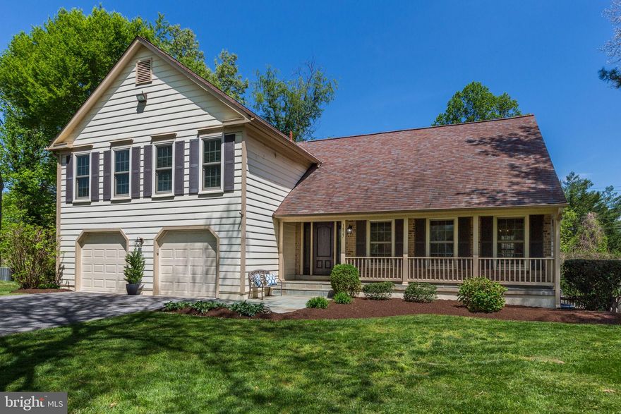 Get ready to be wowed—this home has it all! Beautifully updated inside and out, this spacious home offers 5 bedrooms, 3 full baths (including two with jetted tubs), and a convenient half bath. From the moment you step inside from the charming front porch, you’ll love the sun-filled, open floor plan that blends style and comfort. The renovated gourmet kitchen is a showstopper, featuring high ceilings, a counter bar, and a full breakfast room overlooking the inviting family room. With its wood-burning fireplace, wood beams, and built-ins, the family room is the perfect space for relaxing or entertaining. A separate counter bar with a wine refrigerator adds a special touch for hosting. You’ll also enjoy direct access to the expansive rear deck from the family and breakfast rooms—ideal for outdoor dining or simply relaxing. The formal living room boasts vaulted ceilings, while the elegant dining room flows seamlessly into the kitchen, creating a natural gathering space for holidays and special occasions. Upstairs, the primary suite is a true retreat. French doors lead to a luxurious spa bath with a jetted soaking tub, double vanities, built-in cabinetry, a water closet with a separate shower, and a large walk-in closet. The home has been meticulously maintained with thoughtful updates throughout: new kitchen appliances (2024–2025), updated HVAC (2023), newer windows (2016), freshly painted, hardwood flooring, new upper-level bedroom carpet (2025), and a fully finished lower level with lux vinyl flooring (2024) 5th bedroom with full bath, large recreation room, utility room, and walk-out access to the backyard. Located on a private cul-de-sac on a .26 acre lot in a warm, welcoming community with charming sidewalk streets, this home offers a 2-car garage and easy access to parks, shopping, and major commuter routes. Welcome Home!