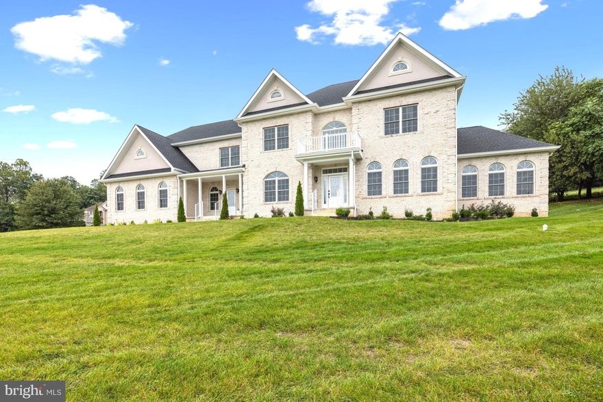 Motivated seller - price reduced! Construction just completed on this NEW luxury residence, offering everything a buyer could want, in an exclusive ten-home community with large rolling lawns and similar luxury homes. In  a prime location near downtown Damascus and I-270, the home is sited on a cul-de-sac, and is approached via a long driveway leading to the impressive white brick property with three-car garage. The home enjoys a wonderful open floor plan and the house spans approximately 9,750 total square feet on three fully finished levels. The main entrance to the home leads to an impressive two-story Foyer with sparkling chandelier and sweeping curved staircase. A large Living Room accommodates guests, as does the generous Dining Room with wainscoting and designer lighting. Ten foot ceilings, hardwood floors and fine trim work combine to make these rooms special. The outstanding Chef's Kitchen reflects the latest in kitchen design, with an oversized center isle, plenty of cabinetry, gorgeous quartz countertops and backsplashes, designer fixtures, extra ovens, recessed Kitchen Aid refrigerator and beverage cooler.  A Breakfast Room is adjacent to the Kitchen, lined with windows, providing access to the rear yard. At the center of the home is the large Family Room with fireplace. A Library nearby can easily be used as a main level Bedroom with a nearby Half Bath. The Sunroom is a wonder with walls of Palladian windows! Two staircases lead to the Upper Level of the house. A sumptuous Primary Bedroom Suite provides plenty of space for a sitting  area, and offers two very large walk-in closets. The Primary Bath is very special, with a freestanding tub, shower and beautiful quartz tile. Three additional large Bedrooms are on this level, as well as two Full Bathrooms. There is also a separate Laundry Room.  The Lower Level is a world onto itself, with a walk-up entrance and window wells letting in light throughout. A large Recreation Room comes with a Bar area with frig and sink. The Media Room is ready to go! The 6th Bedroom is on this level, as is the Fourth Full Bath, a gym and utility room housing the two zones of HVAC for the home. Outside, a rolling front yard provides a beautiful setting to the one-acre lot, and a patio in the rear is available for dining al fresco, with privacy provided by a row of trees. A conservancy area abuts the back of the property. This is a one-of-a-kind home and not to be missed!